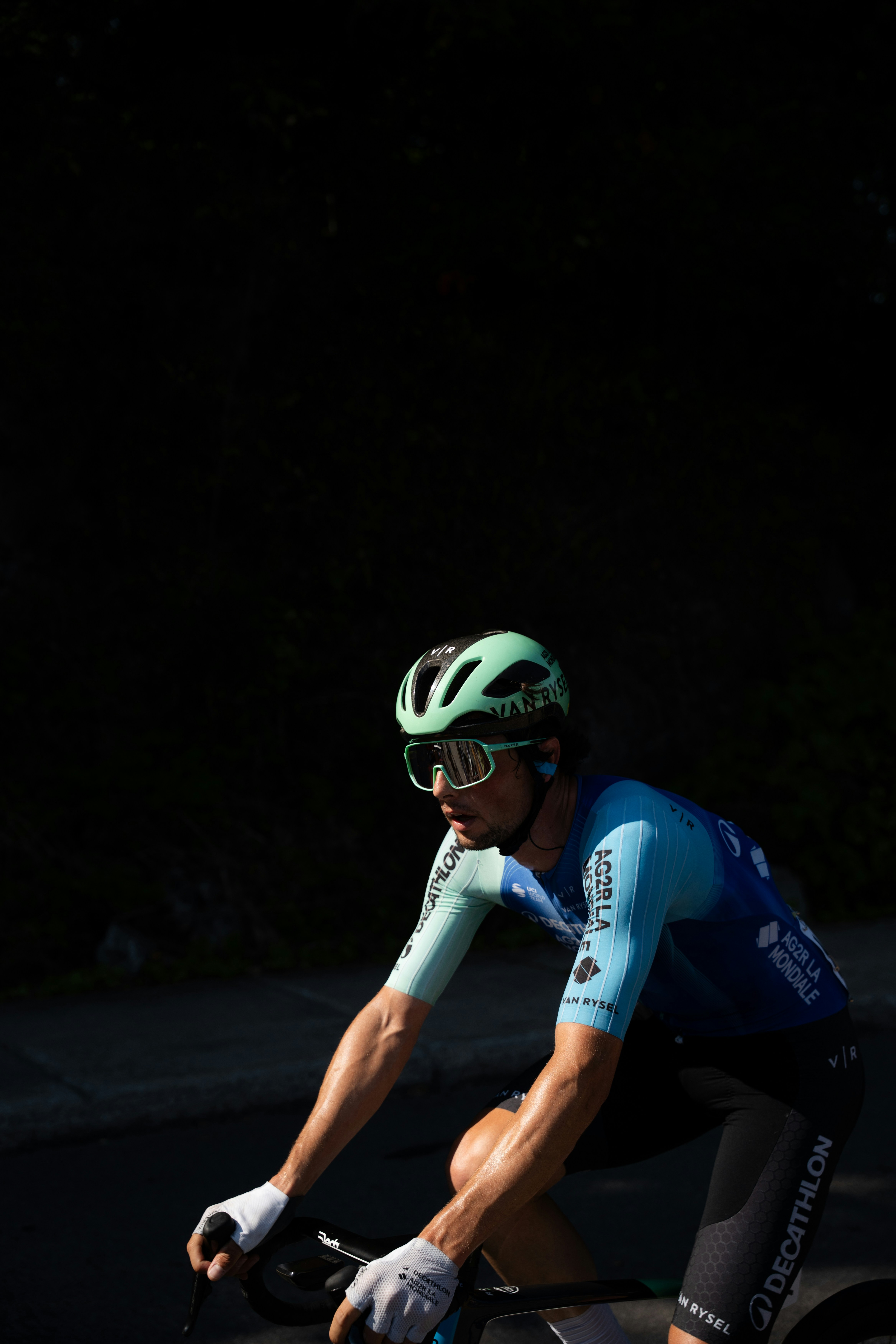 Cyclist in blue jersey riding a bicycle