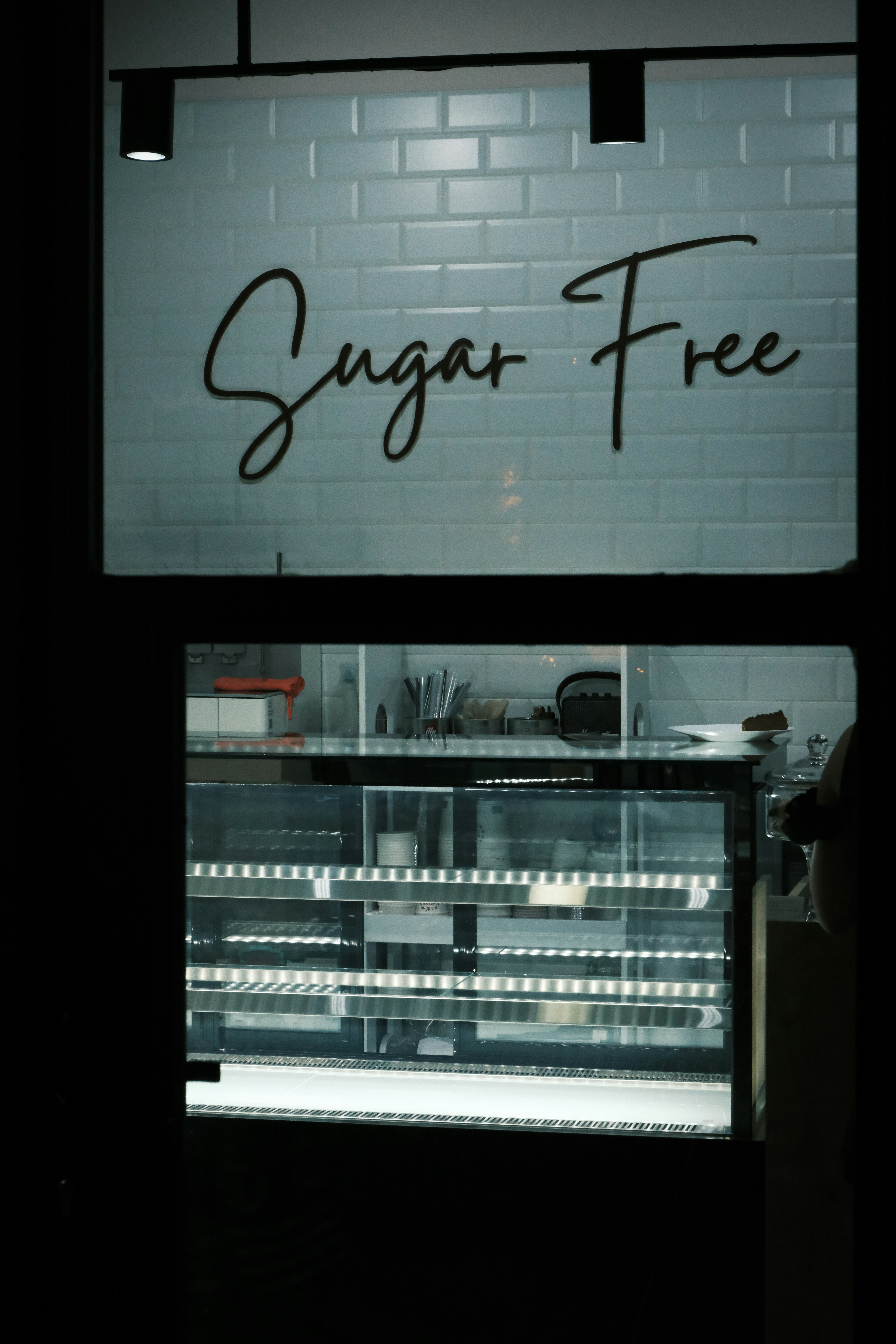 Sugar free sign above empty display case