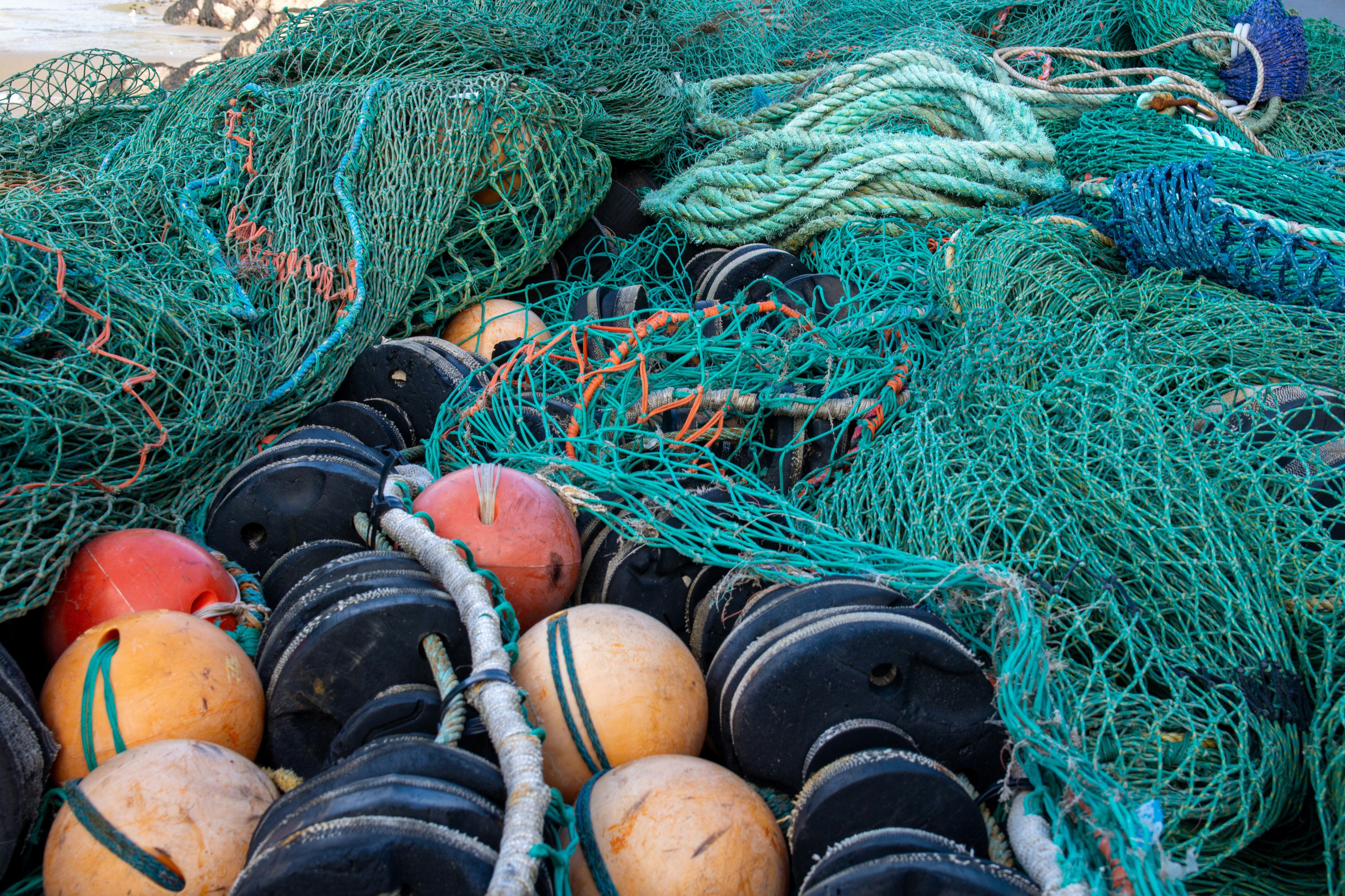 Pile of fishing nets and buoys