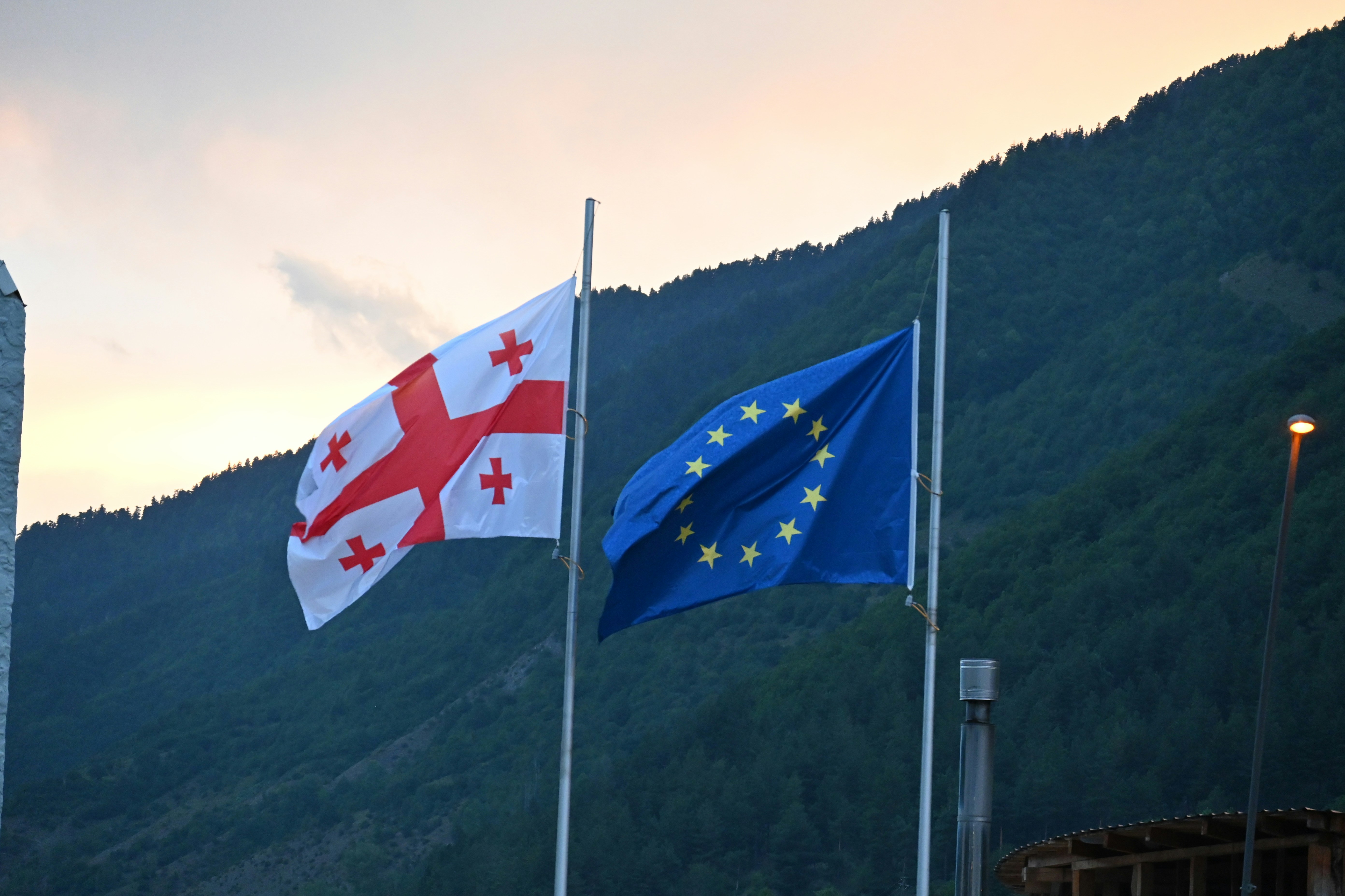 Georgian and european union flags waving