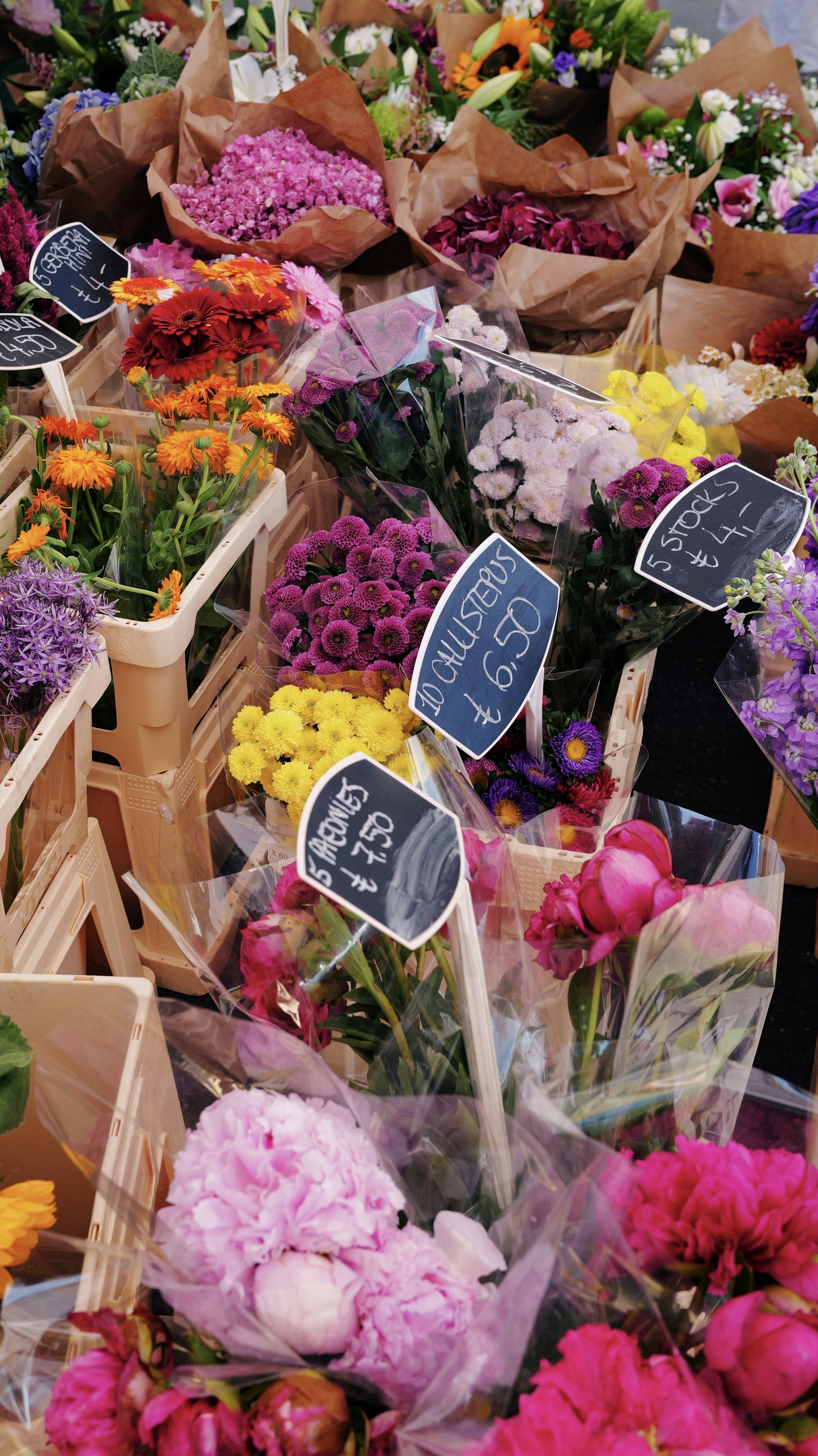 Colorful bouquets of flowers displayed at a market.