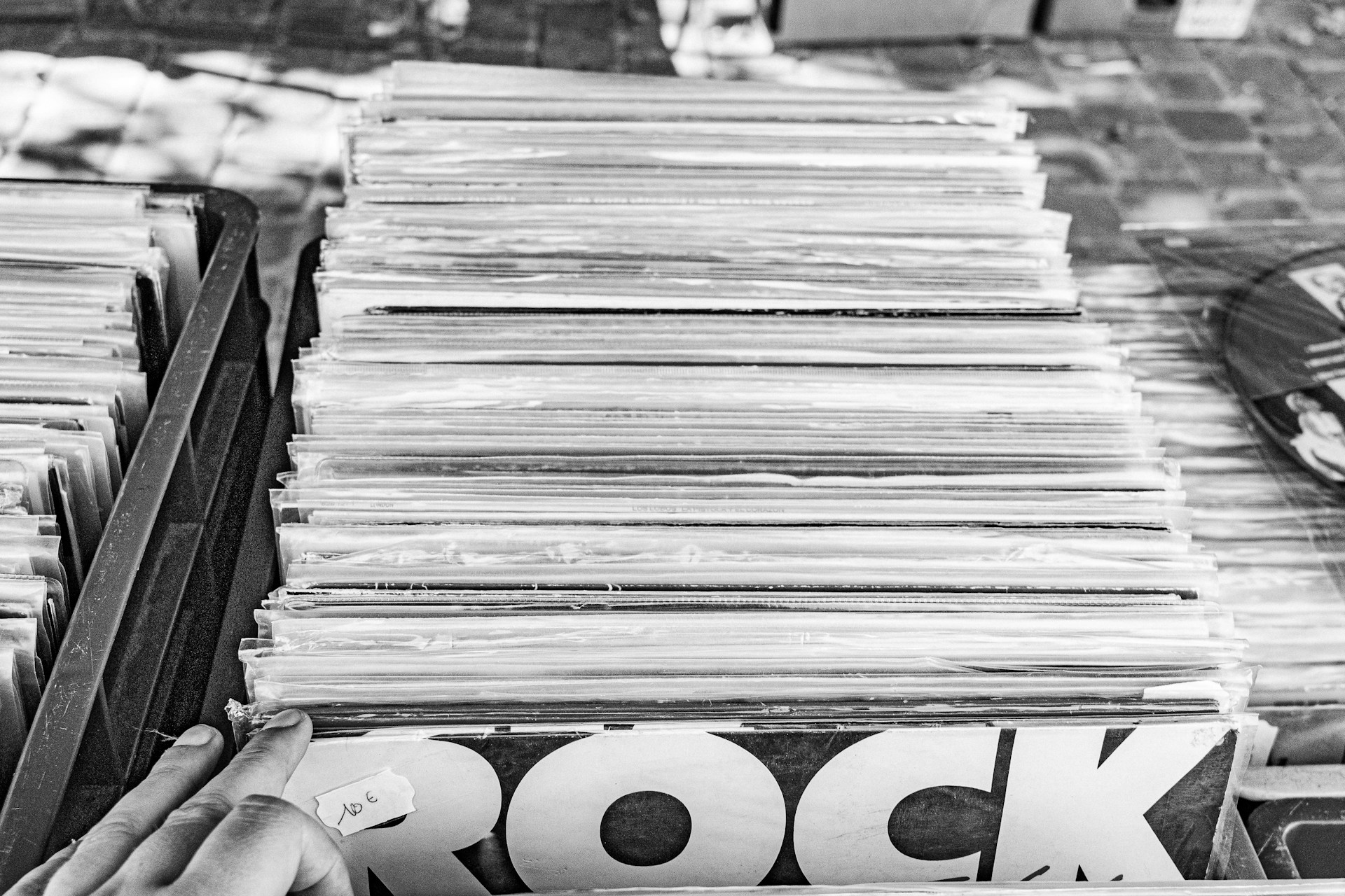 Stack of vinyl records with 'rock' visible