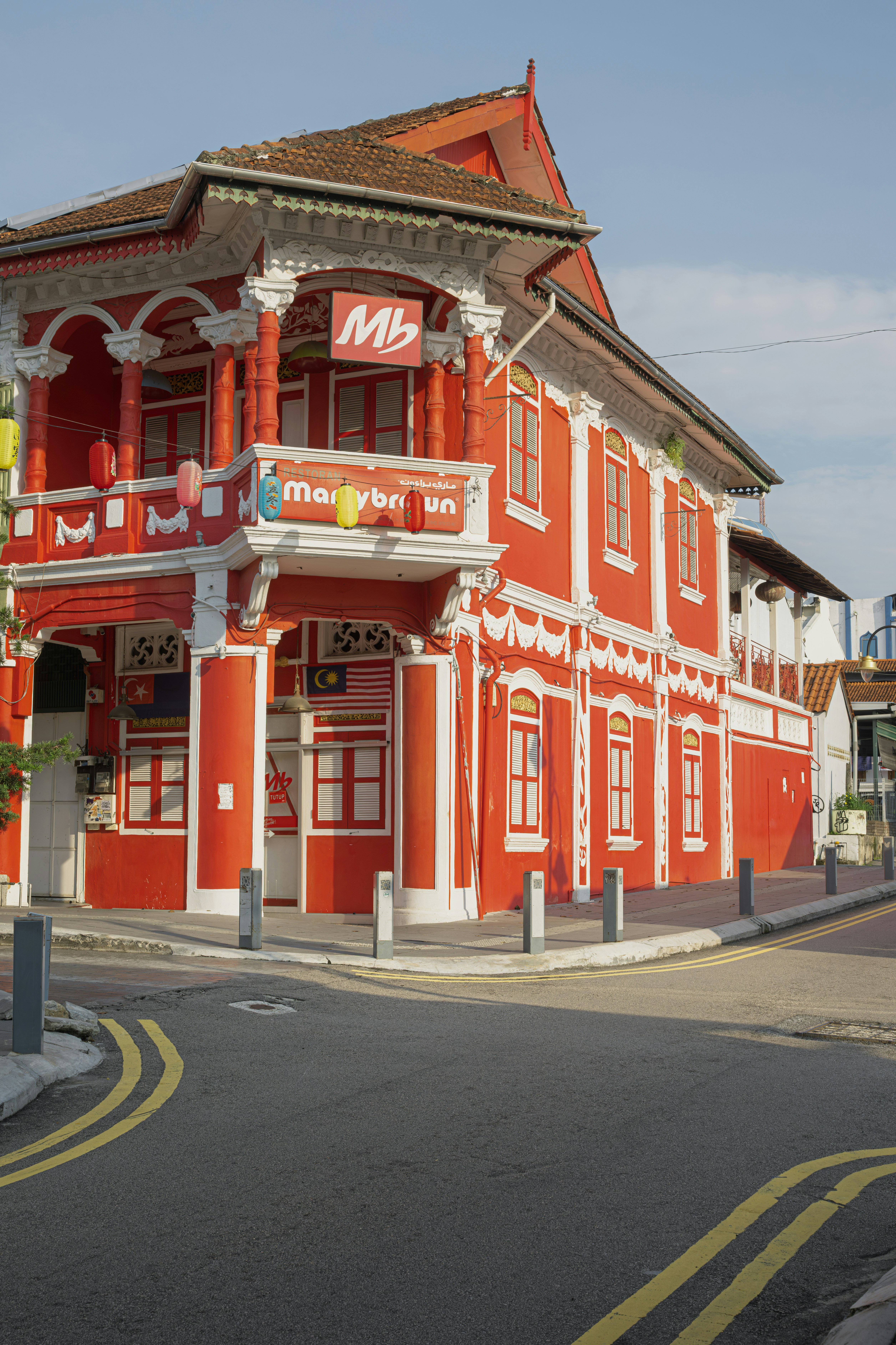 Bright red building with white trim on corner