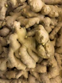 Pile of fresh ginger roots close up