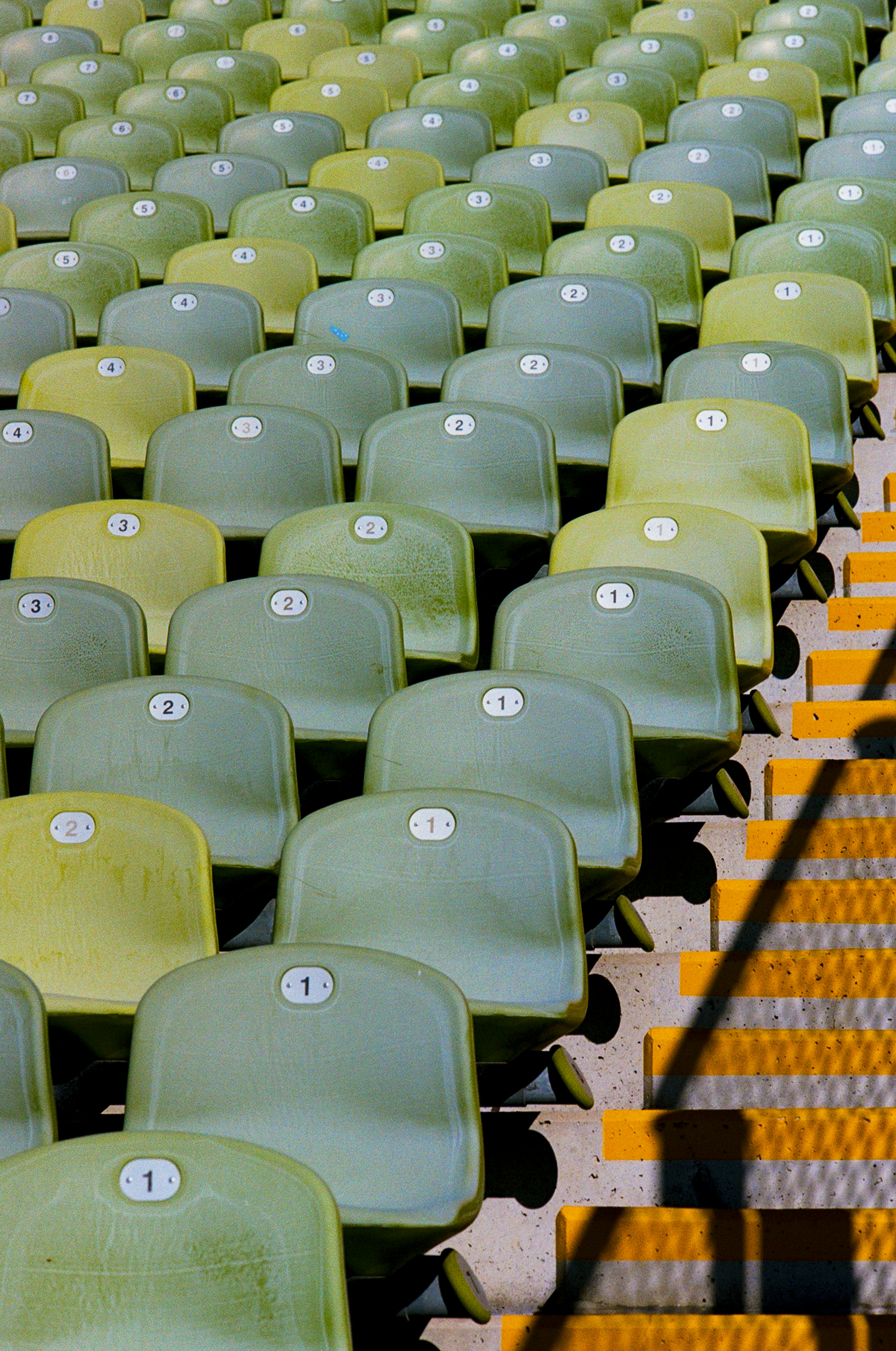 Fans wearing iconic retro football shirts in a stadium