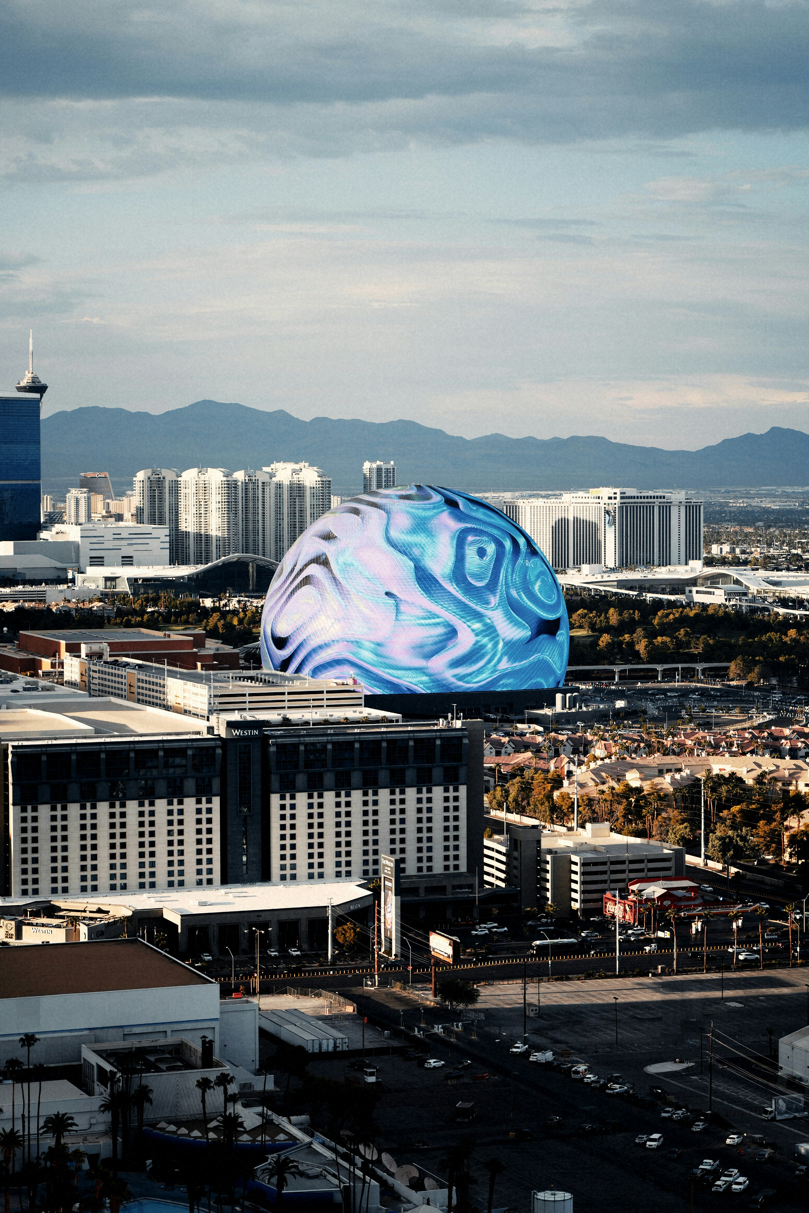 Dome building with swirling blue lights in city