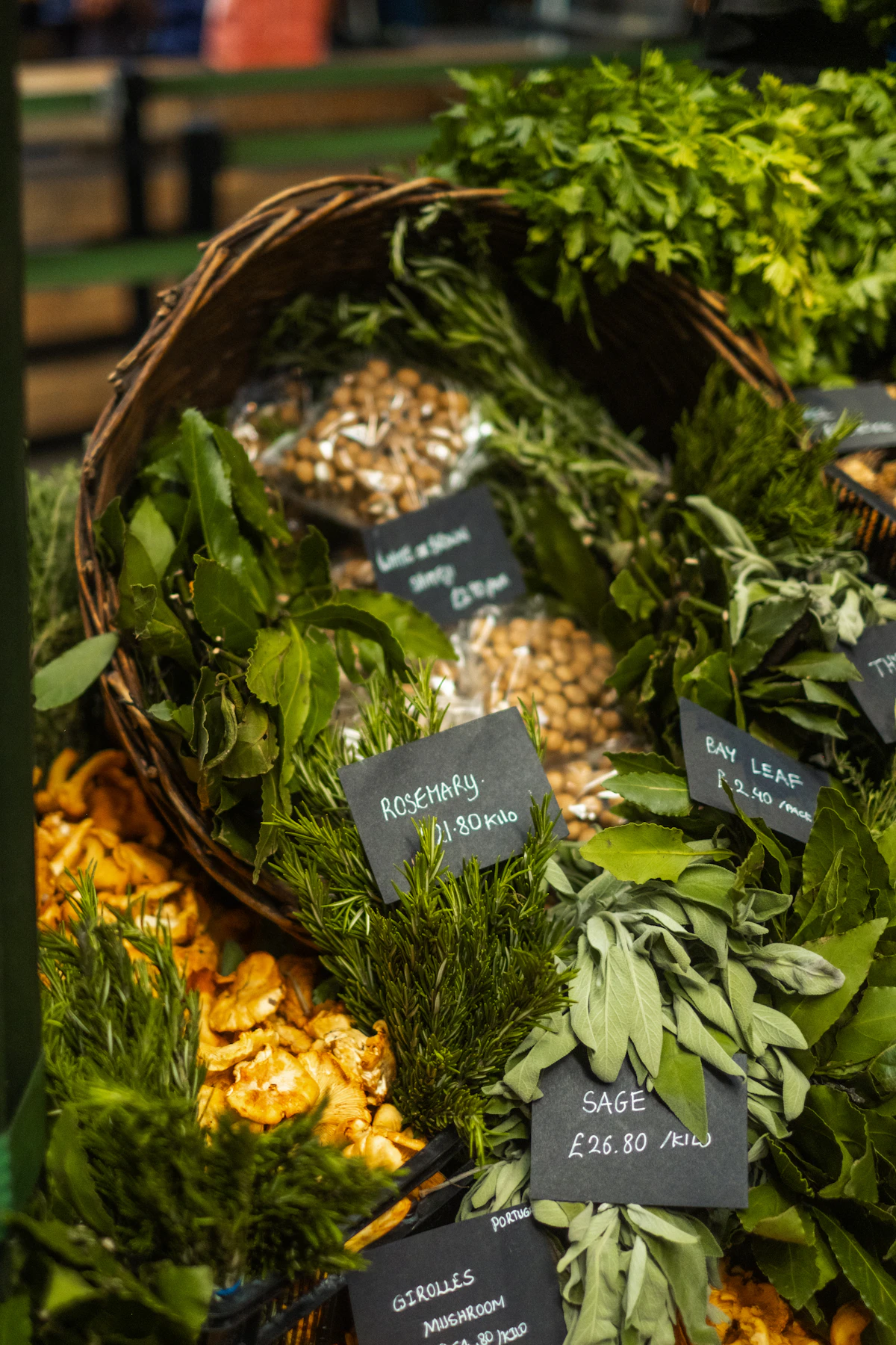 Fresh herbs and dried goods displayed at market