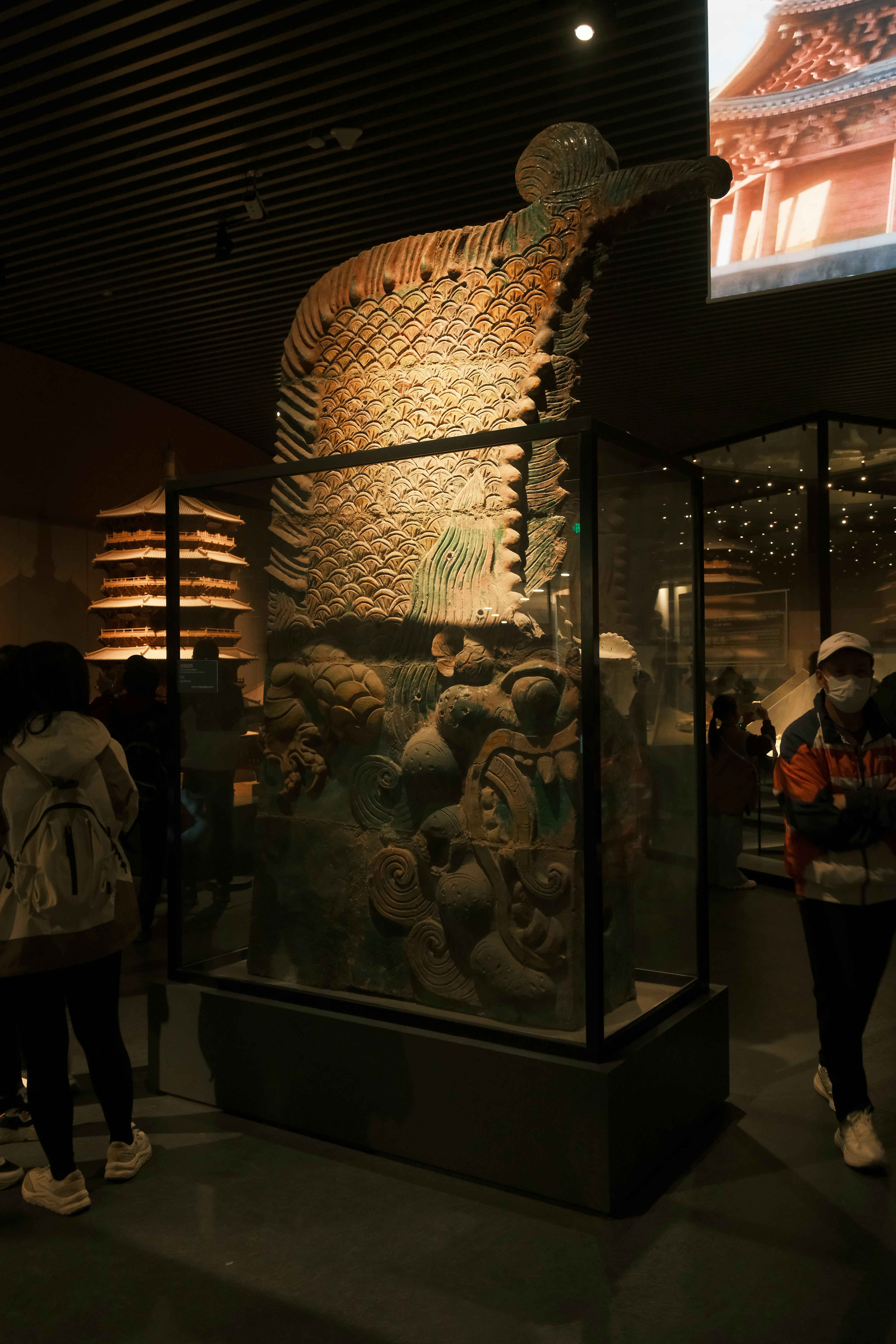 Ancient ornate sculpture displayed in a museum exhibit