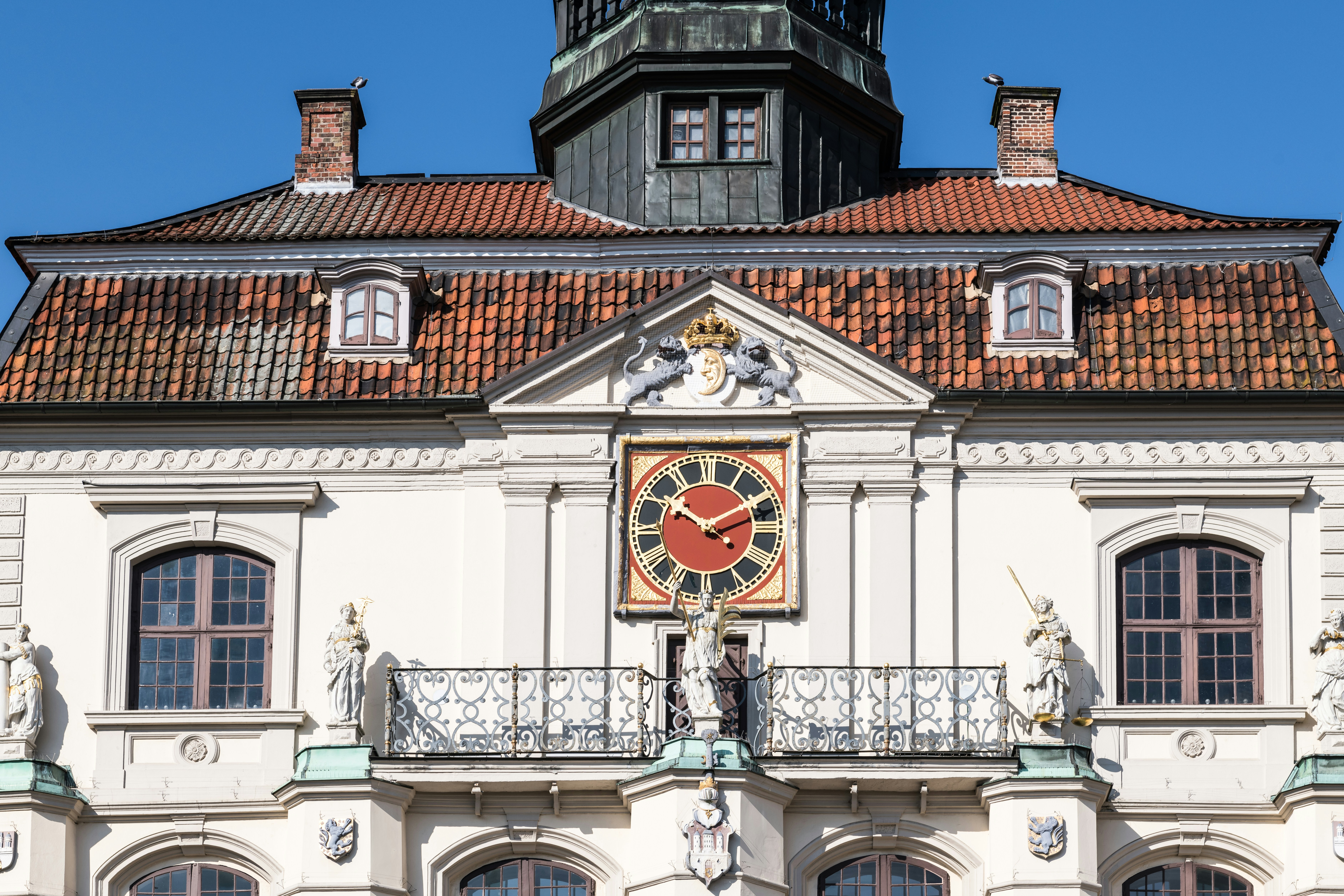 Ornate building facade with a large clock.