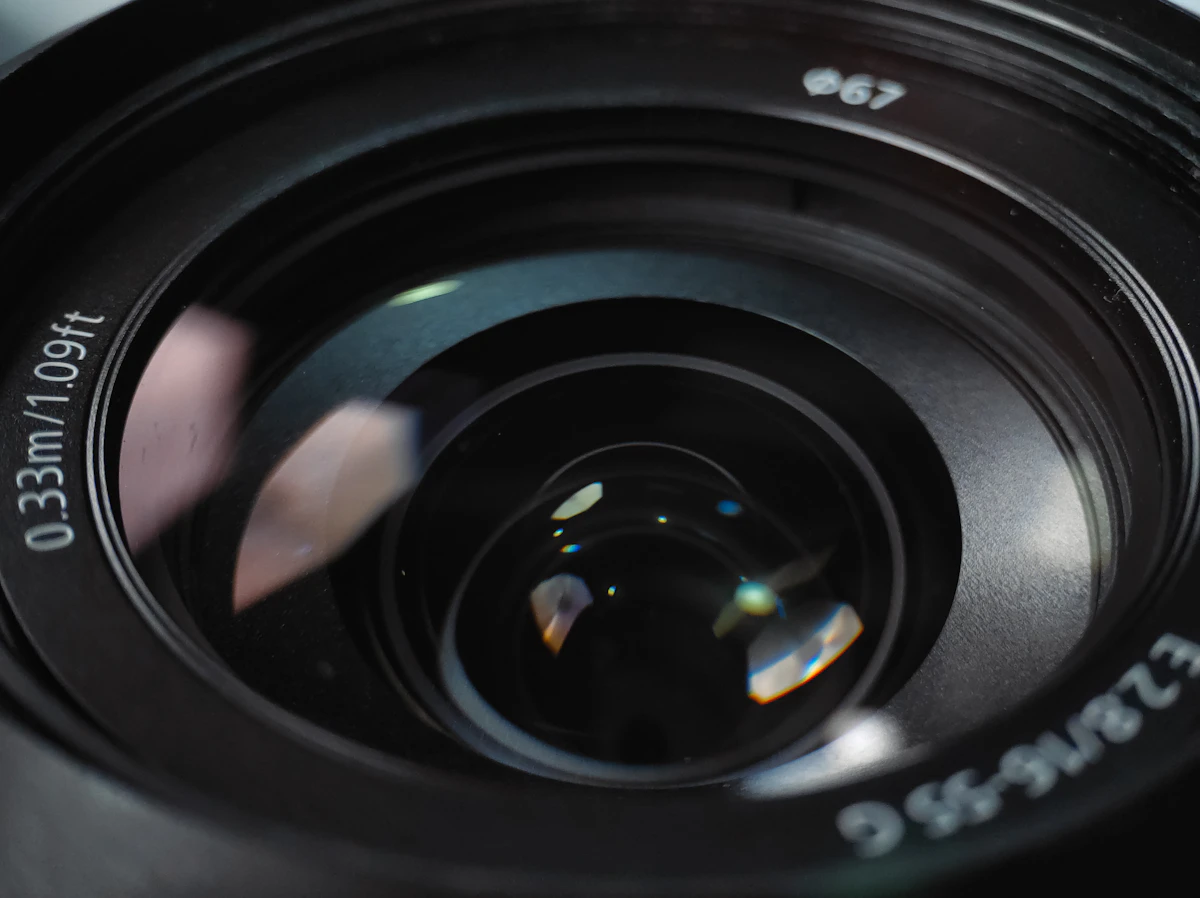 Close-up of a camera lens with reflections
