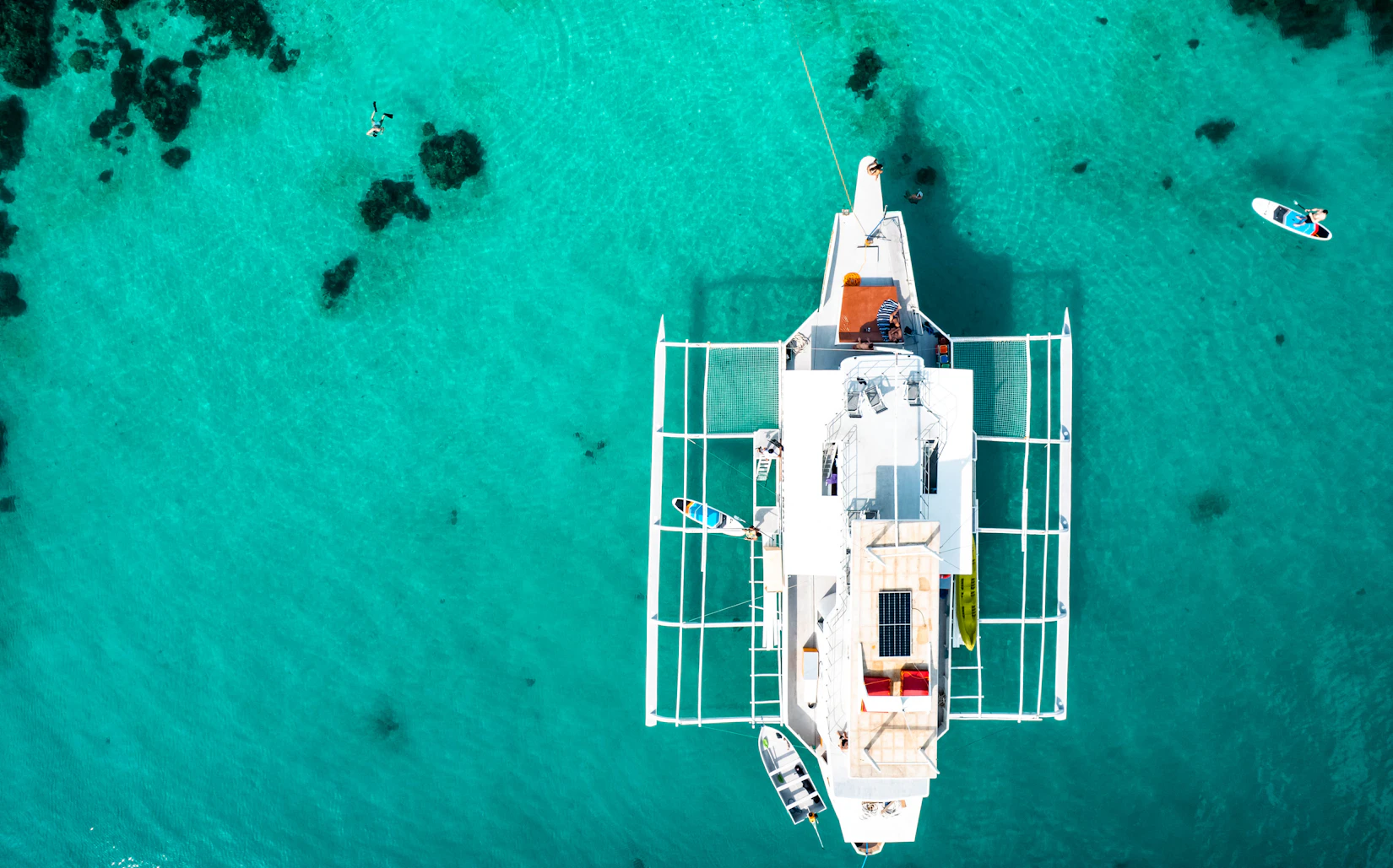 Sailboat on calm turquoise creek waters