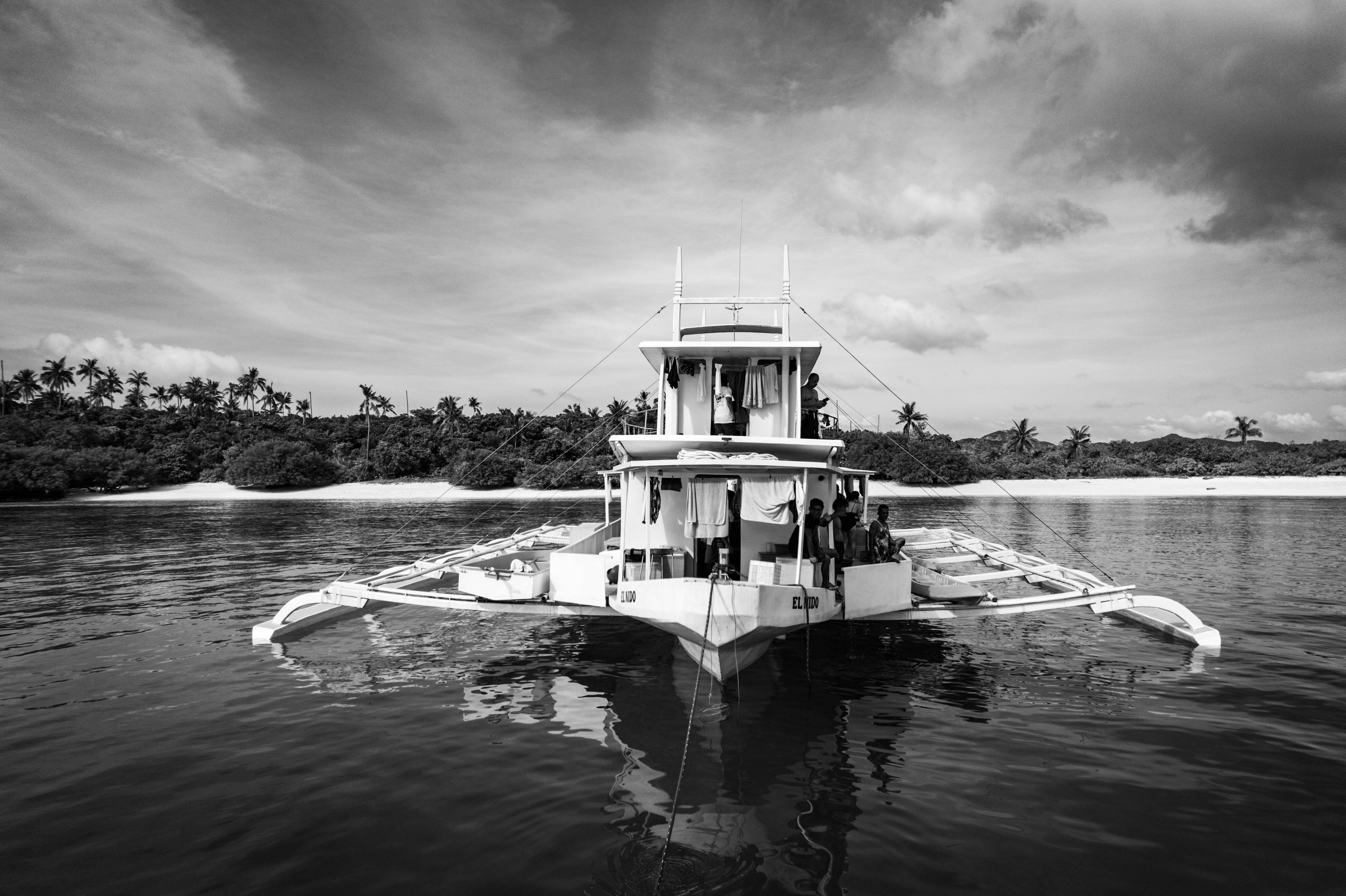 A traditional filipino bangka boat on calm water.