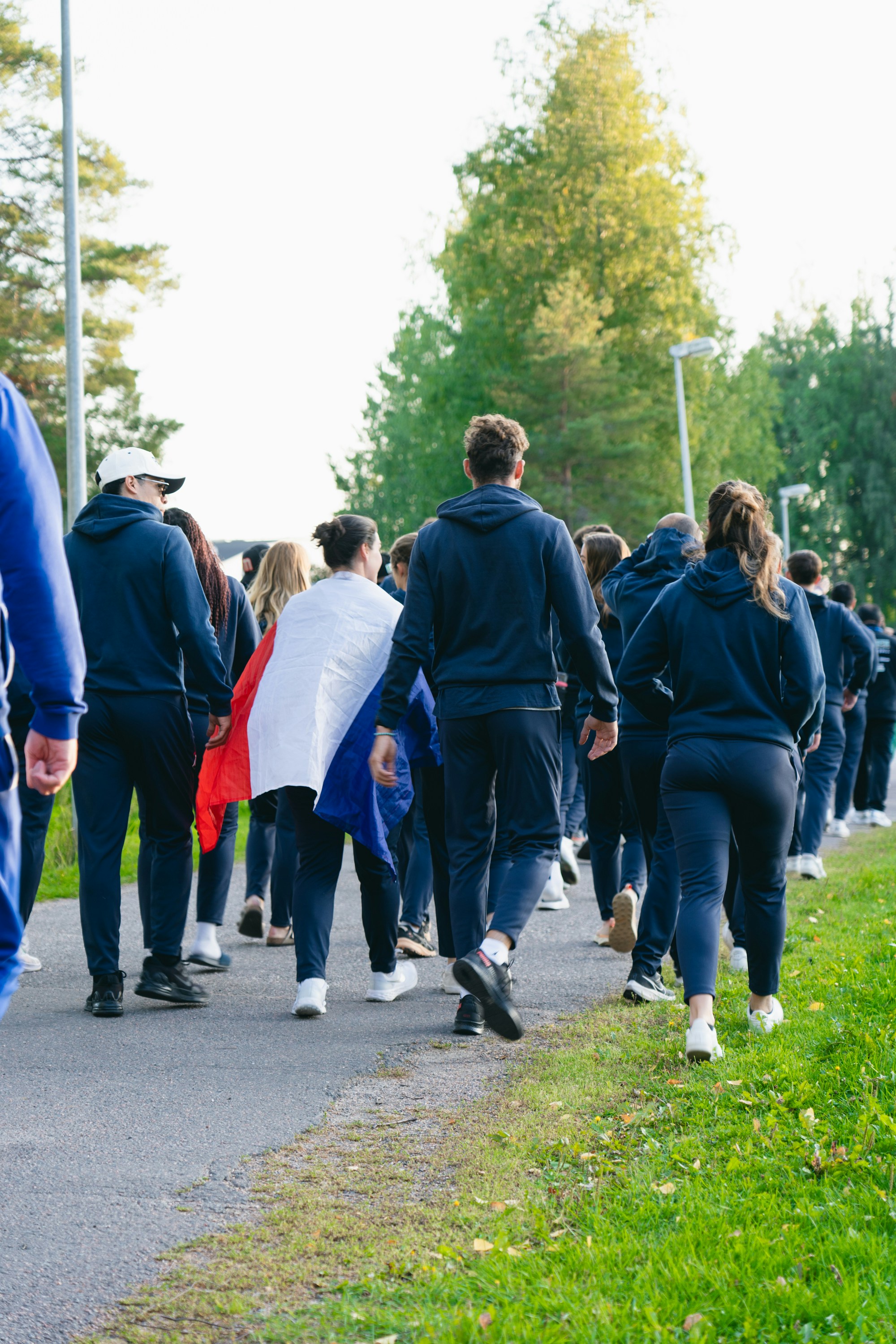 Group of people walking with a flag