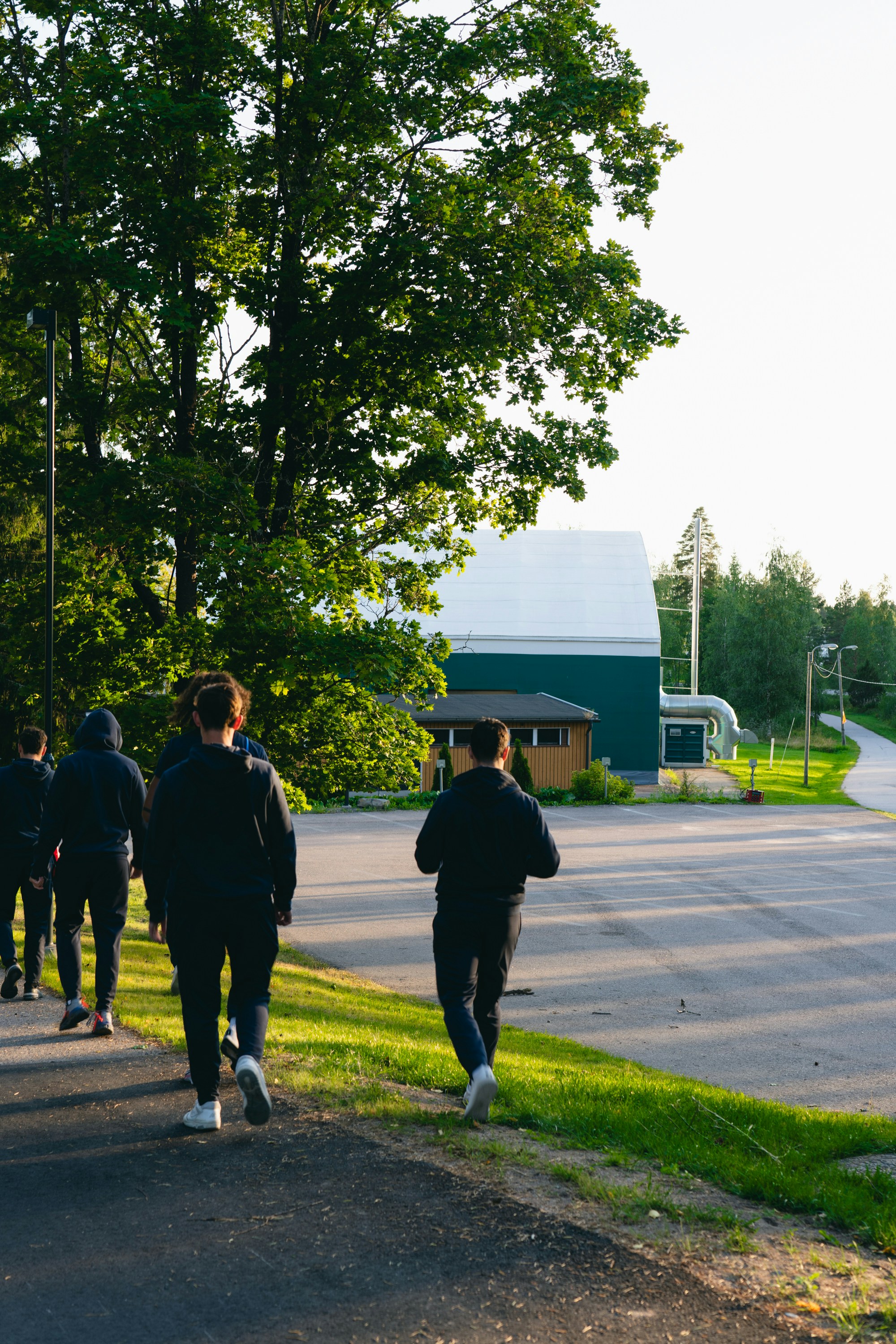 Group of people walking towards a building