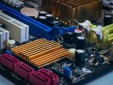 Close-up of a computer motherboard with colorful components.