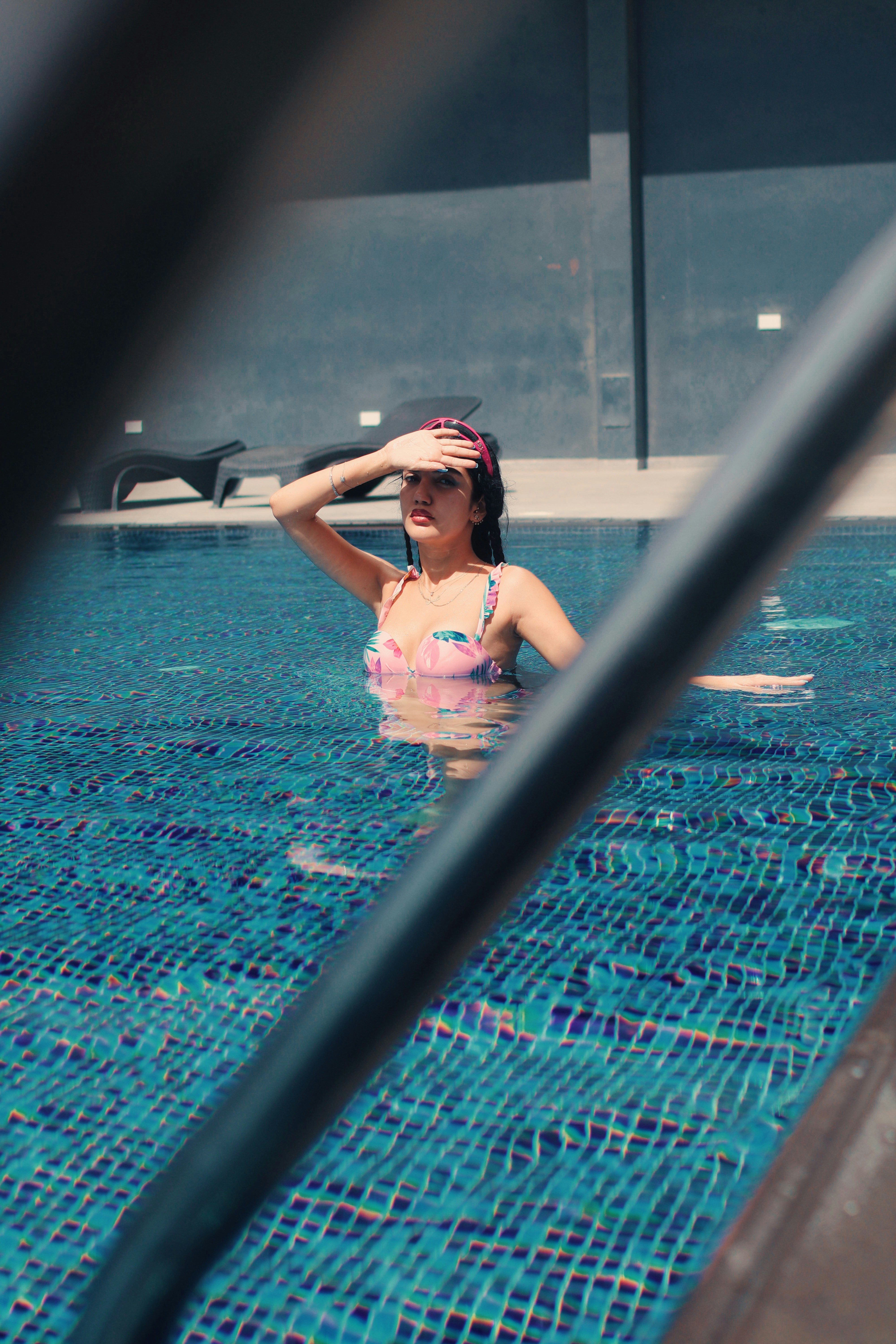 Woman in a colorful swimsuit in a pool