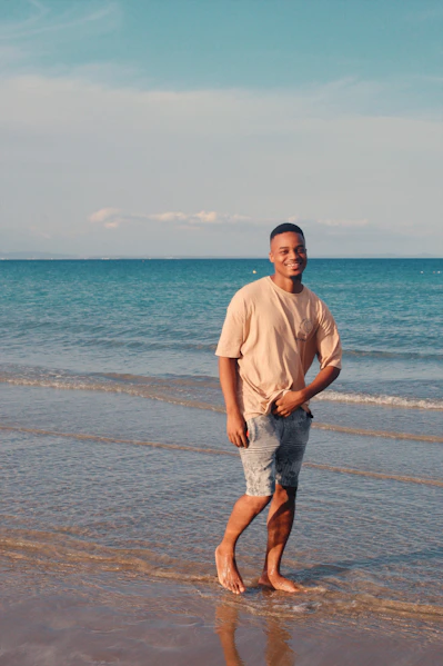 Man standing on a beach near the ocean