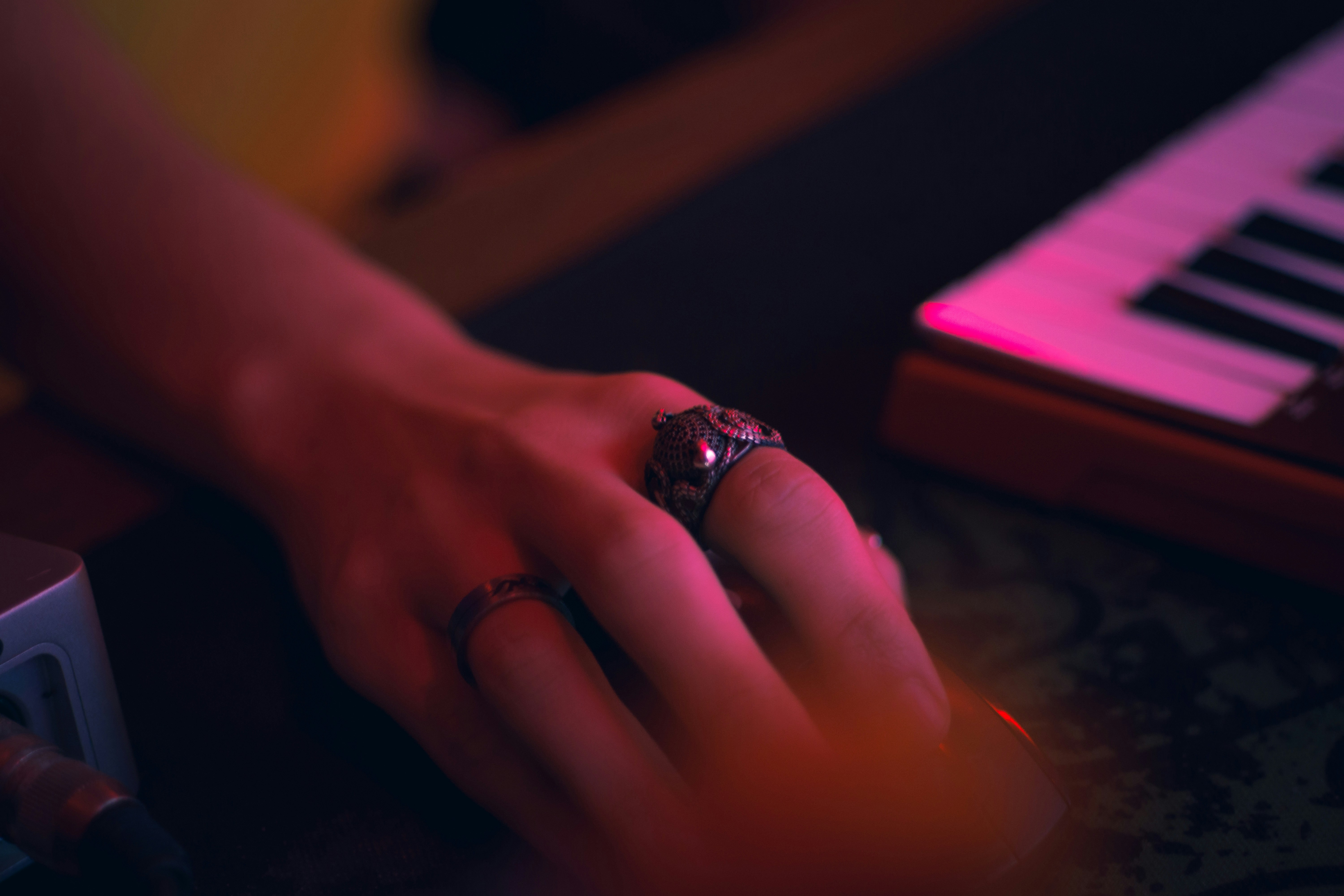 Hand with rings near a keyboard