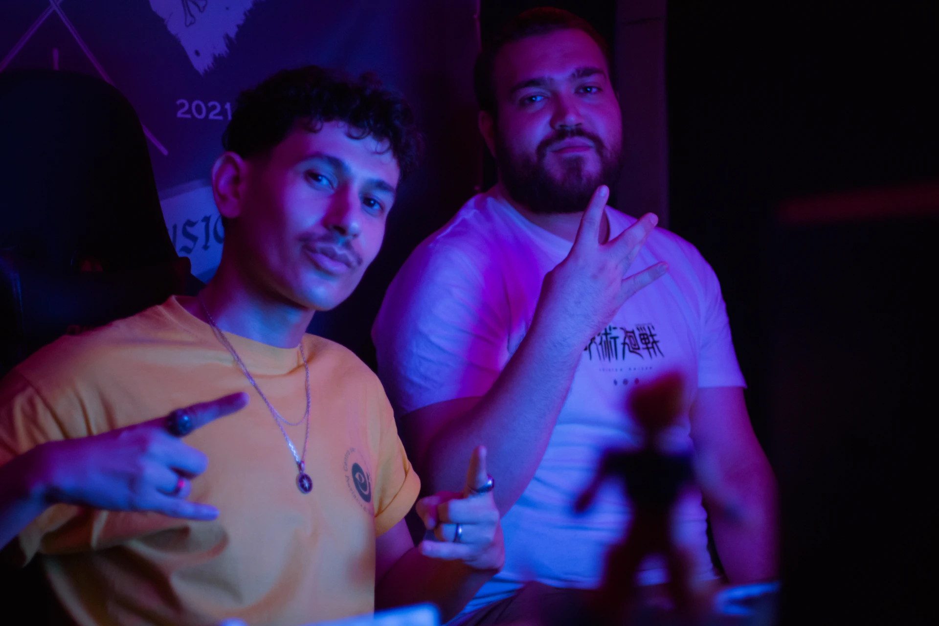 Two men posing for a picture indoors.