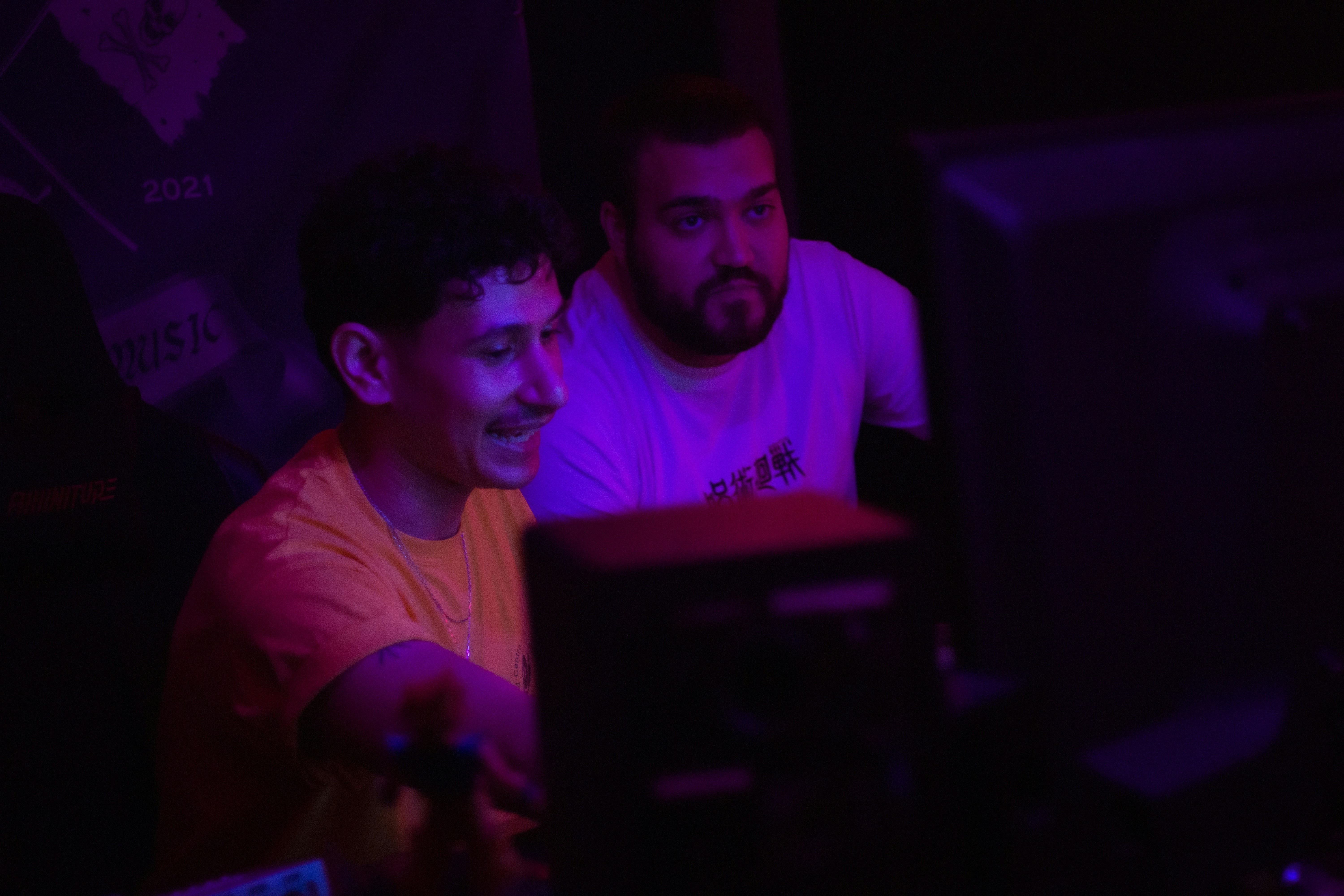 Two men looking at a computer screen