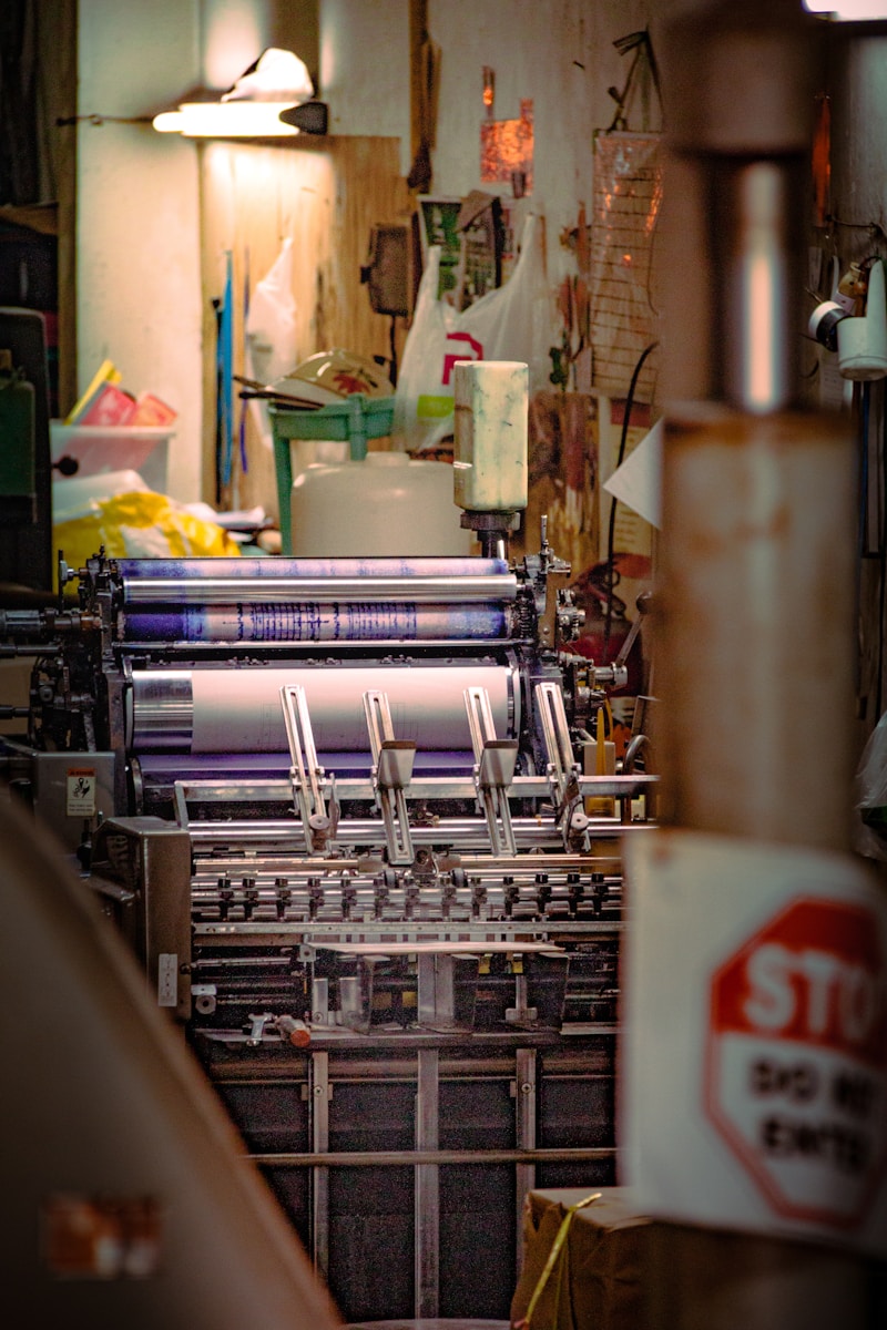 Industrial printing press producing Clermont Local Magazine