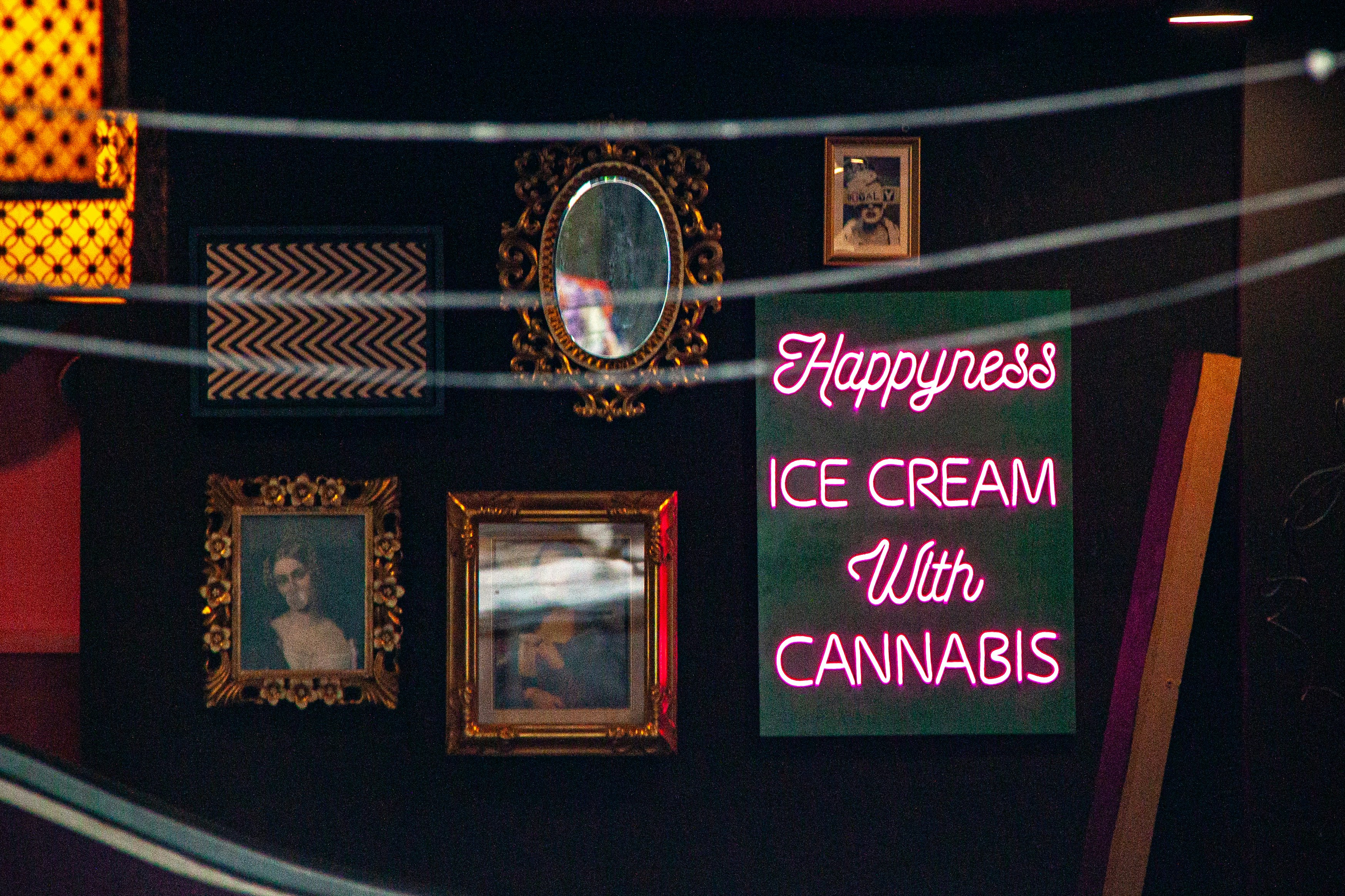 Neon sign advertises ice cream with cannabis.