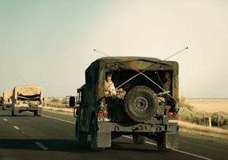 Military vehicles driving on a highway