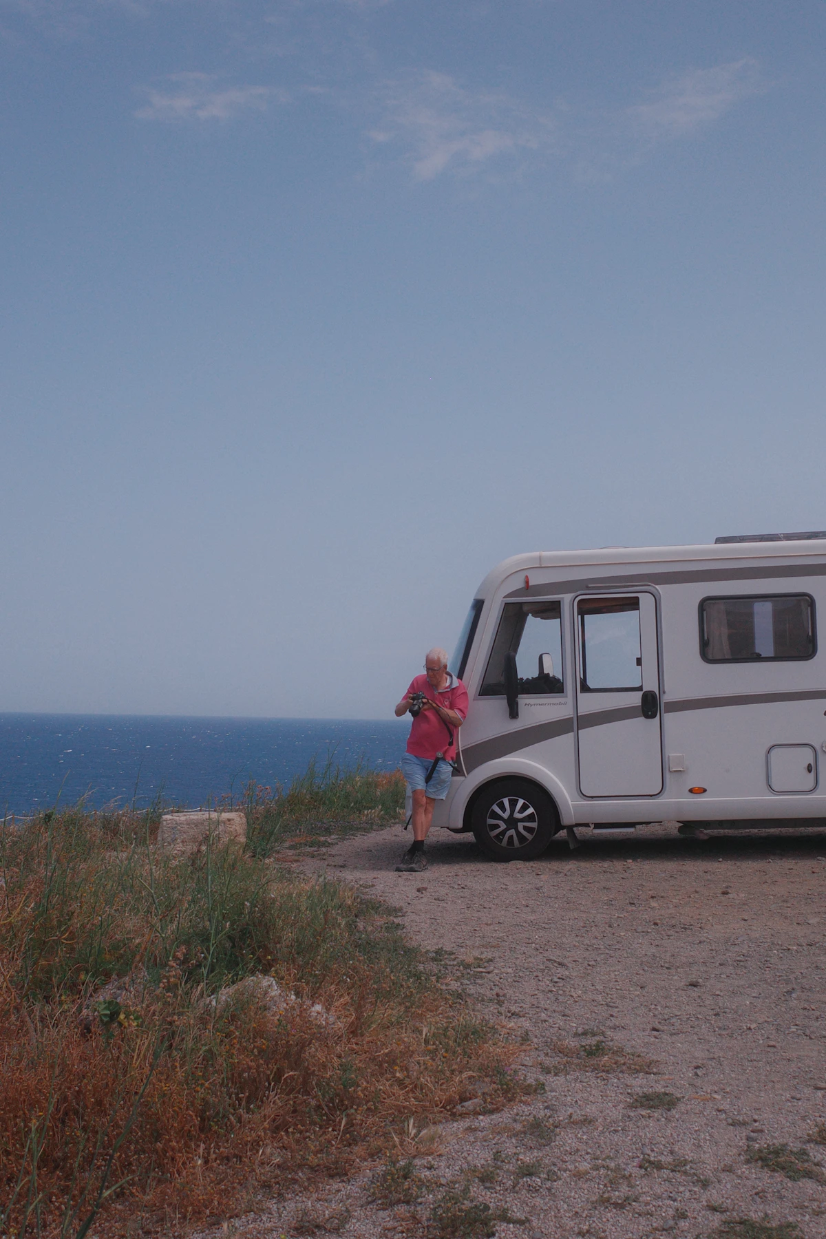RV owner beside a motorhome
