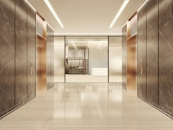Modern elevator lobby with marble and glass accents