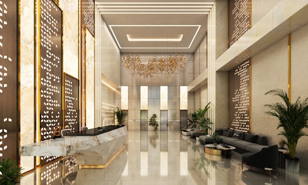 Modern hotel lobby with sleek reception desk and seating.