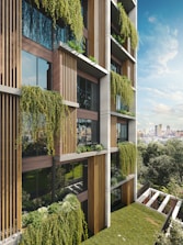 Modern building facade with lush hanging plants and balconies.