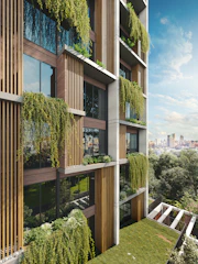 Modern building facade with lush hanging plants and balconies.