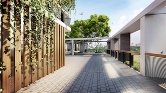 Modern walkway with lush green vines and trees.