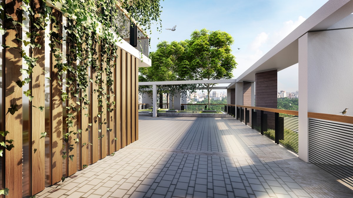 Modern walkway with lush green vines, trees, and professional landscaping