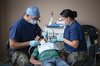 Dentists providing dental care to a patient.