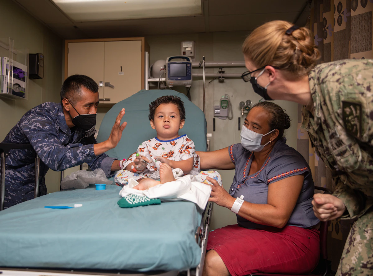 Nurse caring for a child at home