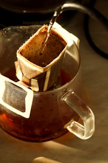 Hot water pouring into a pour-over coffee filter.