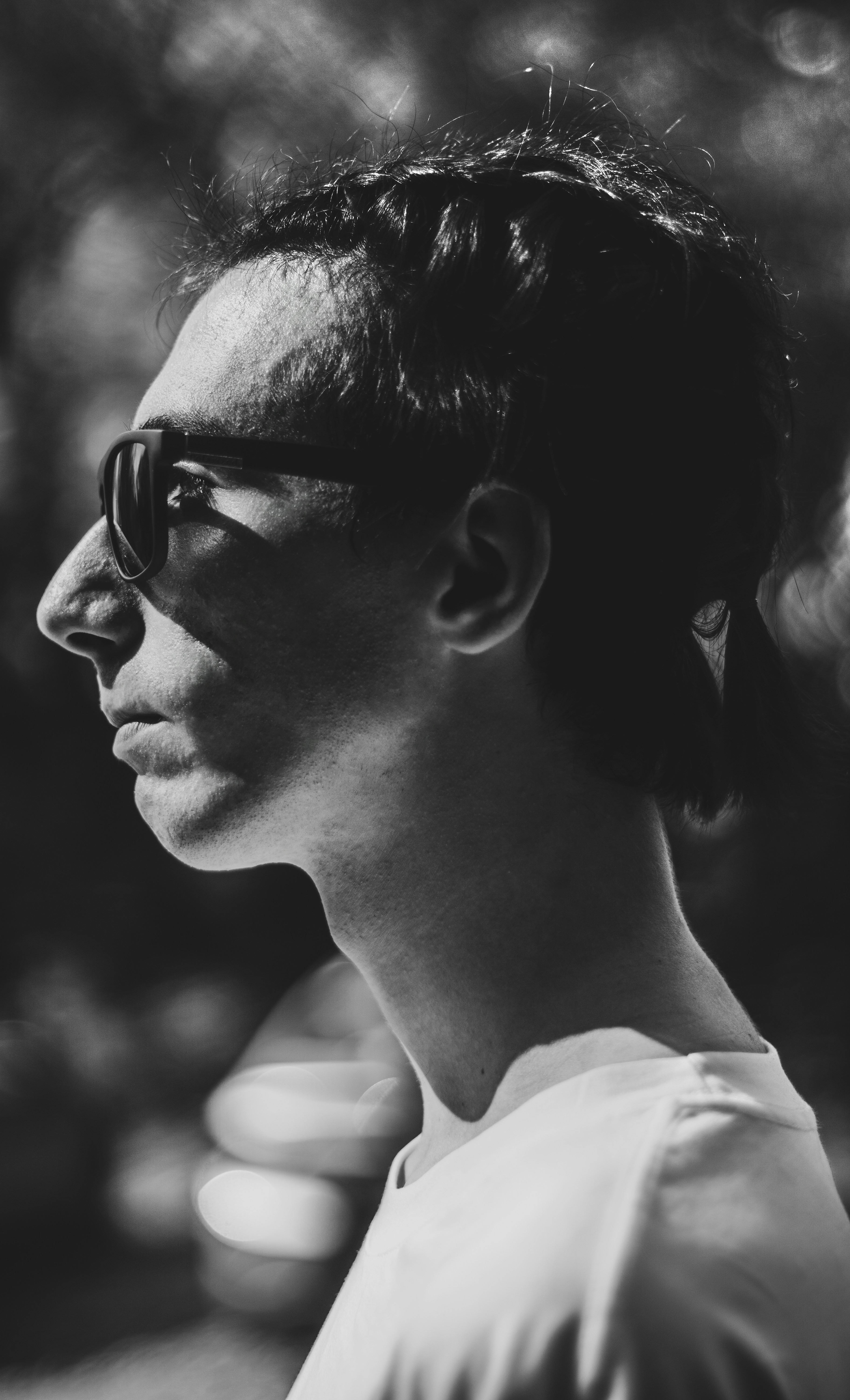 Man wearing sunglasses in profile view