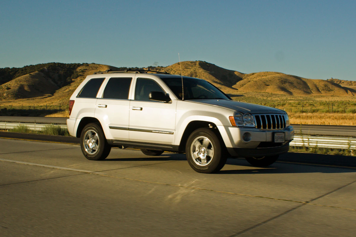 White SUV taxi on an open highway