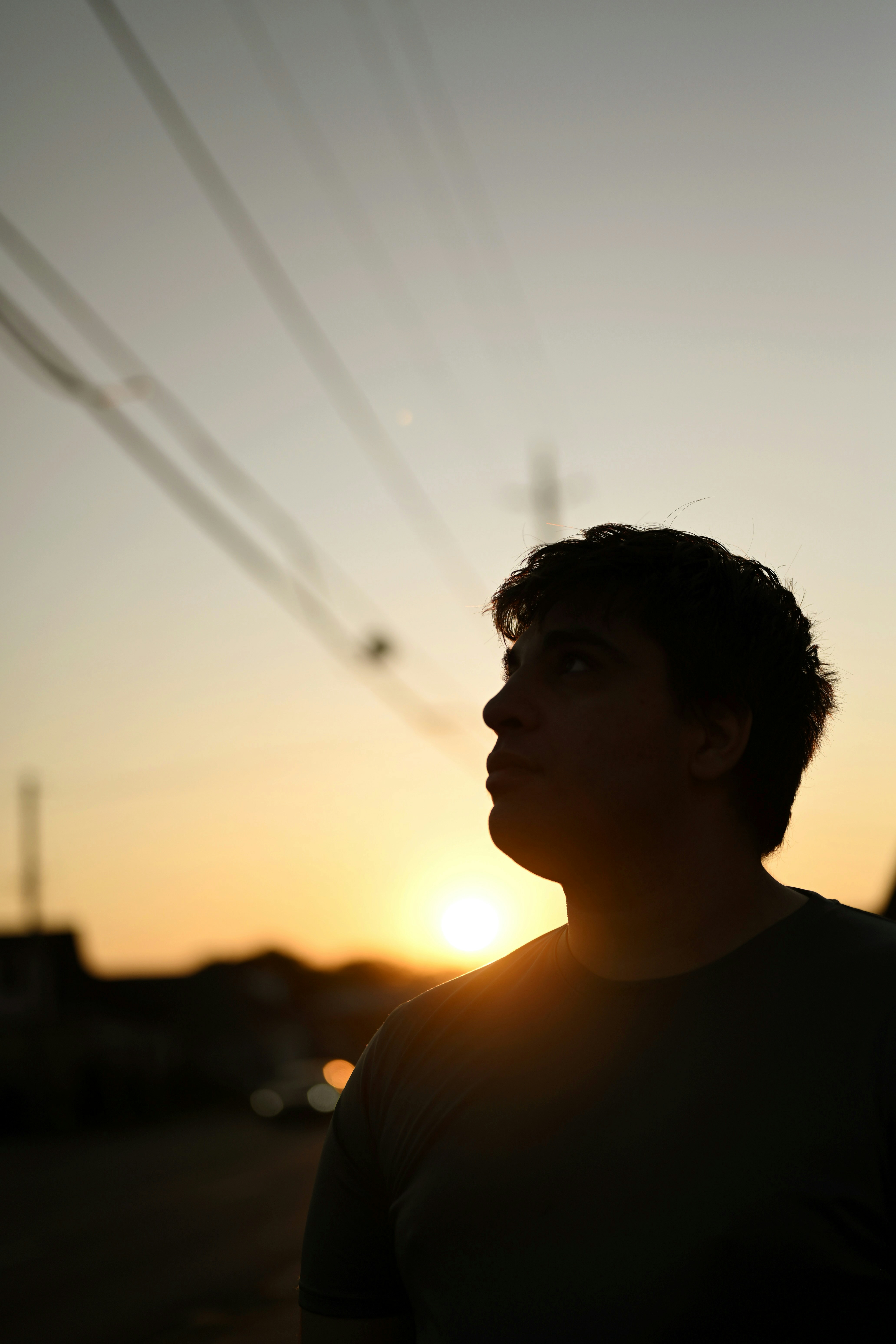 Man silhouetted against a setting sun