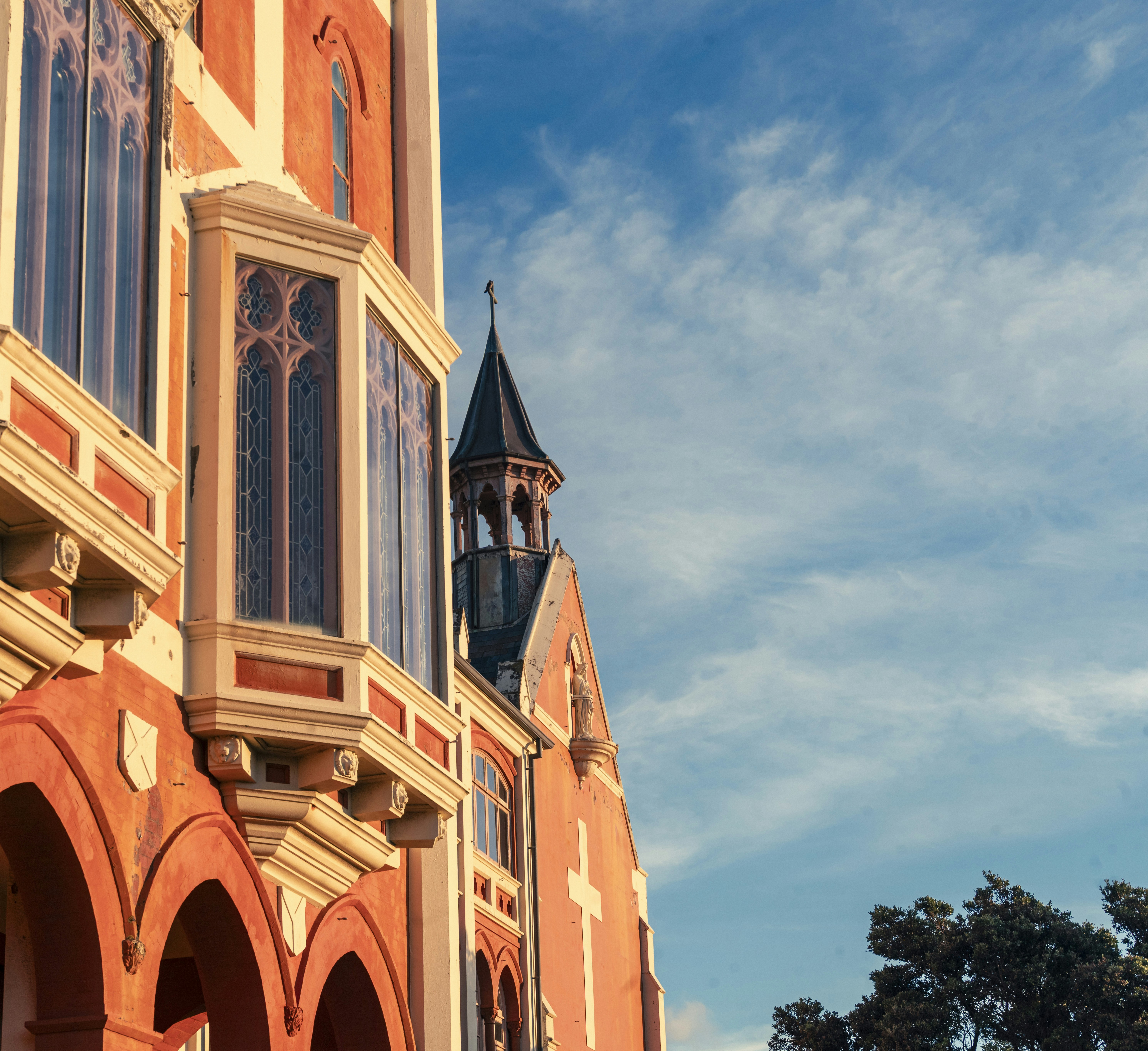 Historic building with gothic architectural details against sky