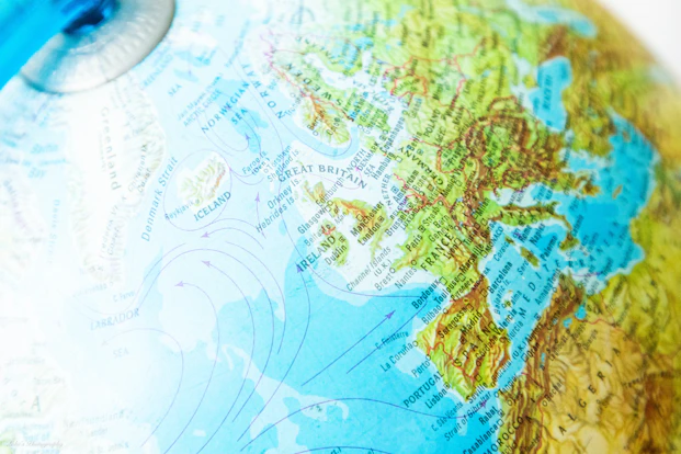 Close-up of a colorful globe showing europe and the atlantic.