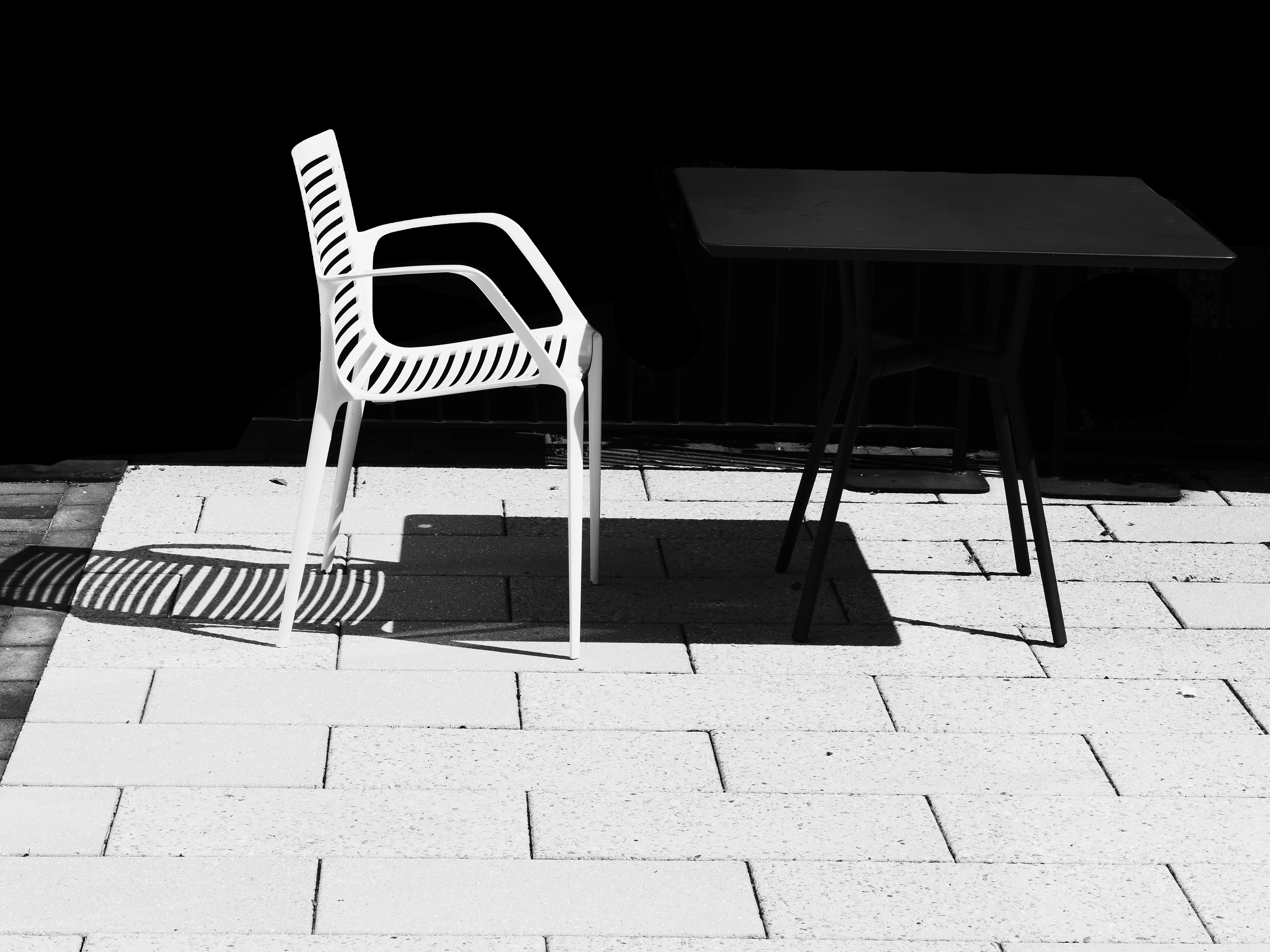 White chair, black table