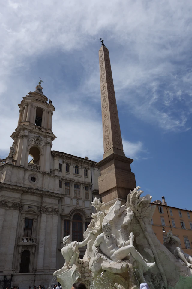 The obelisk and river god statue of the Fountain of the Four Rivers in Piazza Navona