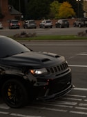 Black jeep grand cherokee srt parked on street
