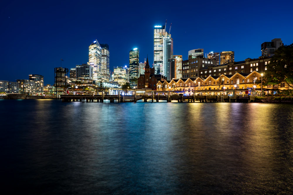 Sydney skyline reflected in the harbour at night