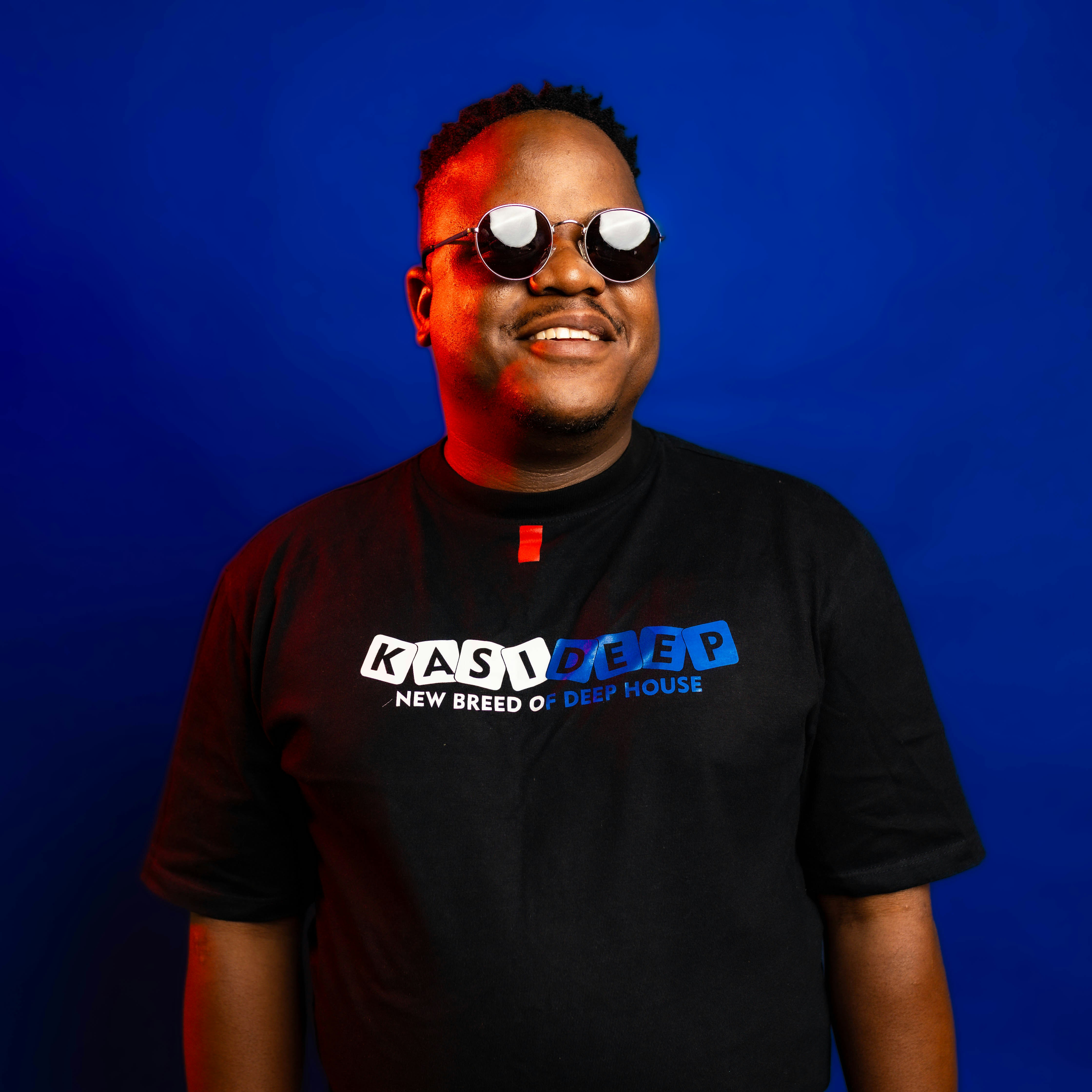 Man wearing sunglasses and a black t-shirt