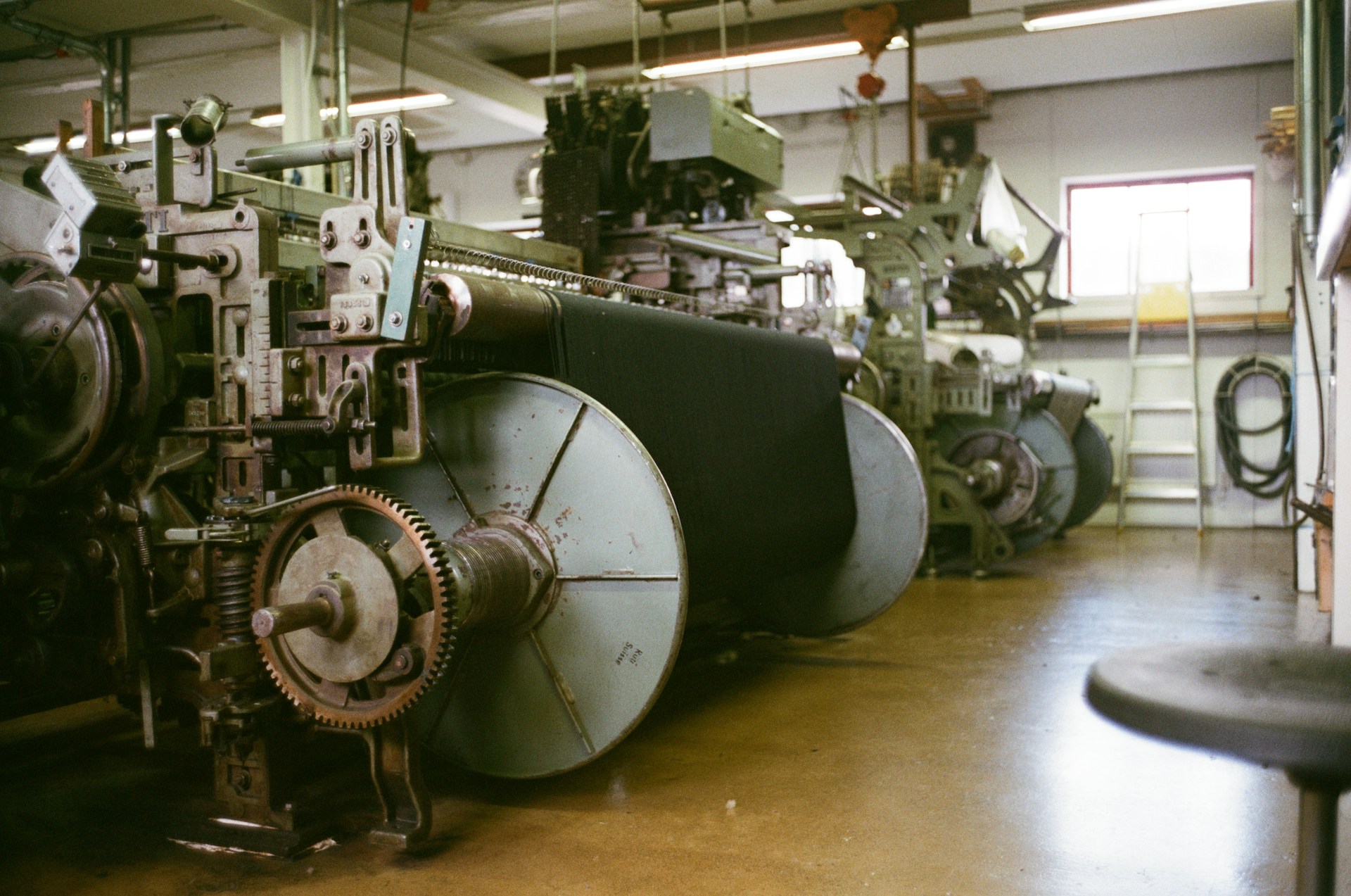 Row of industrial looms in a workshop