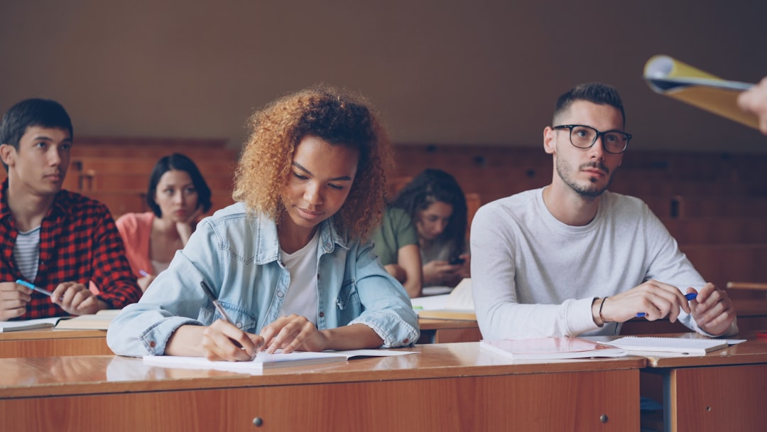 A student concentrating while taking an online exam.