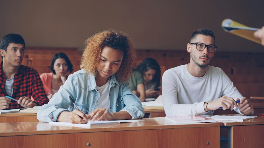 Students taking notes in a university lecture